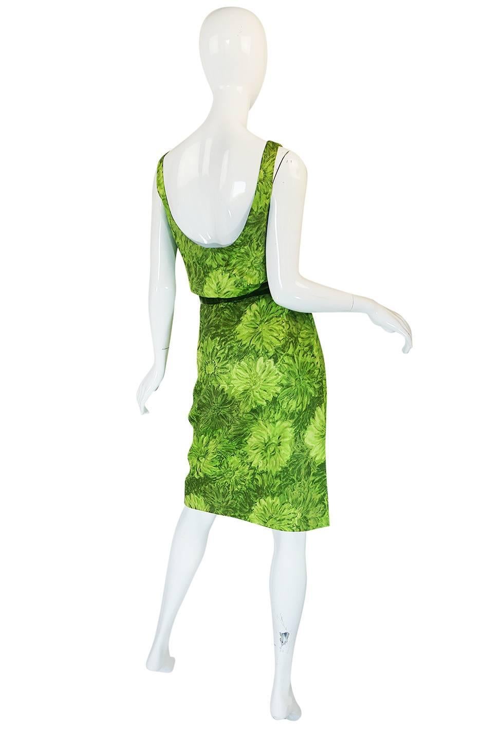 

This is a very pretty green floral cocktail dress by Louis Estevez that is really representative of his early work. Louis Estevez worked for Jean Patou for two years before starting his own label in 1955 and this really shows why women flocked