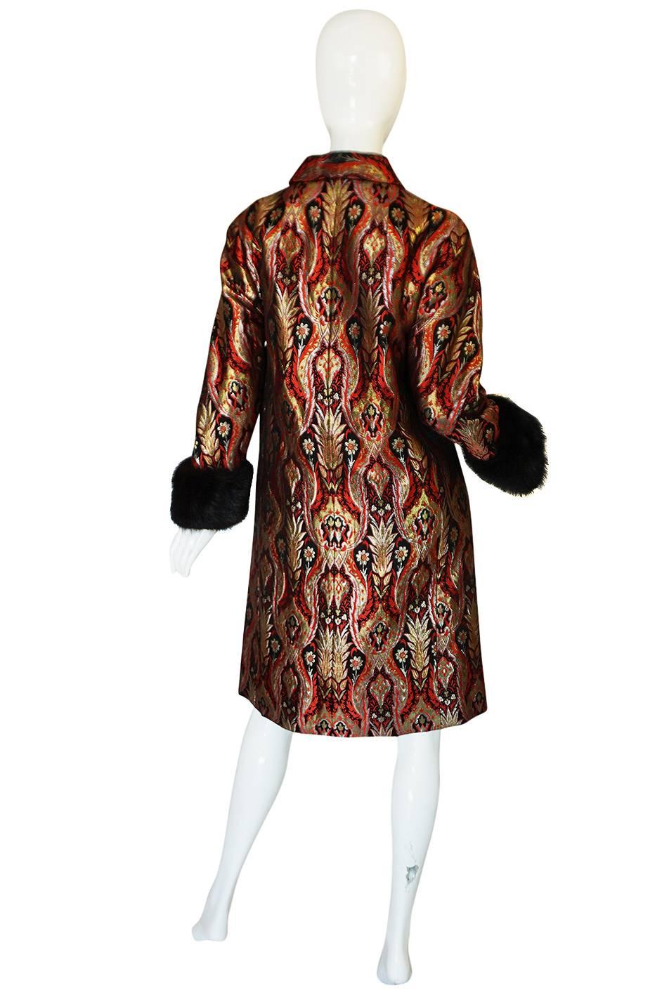 

This is a treasure and a strong statement piece. This insanely fabulous Christian Dior coat can be considered demi-couture as it is primarily hand finished and would have been sent to the New York shop with its design based on the Haute Couture