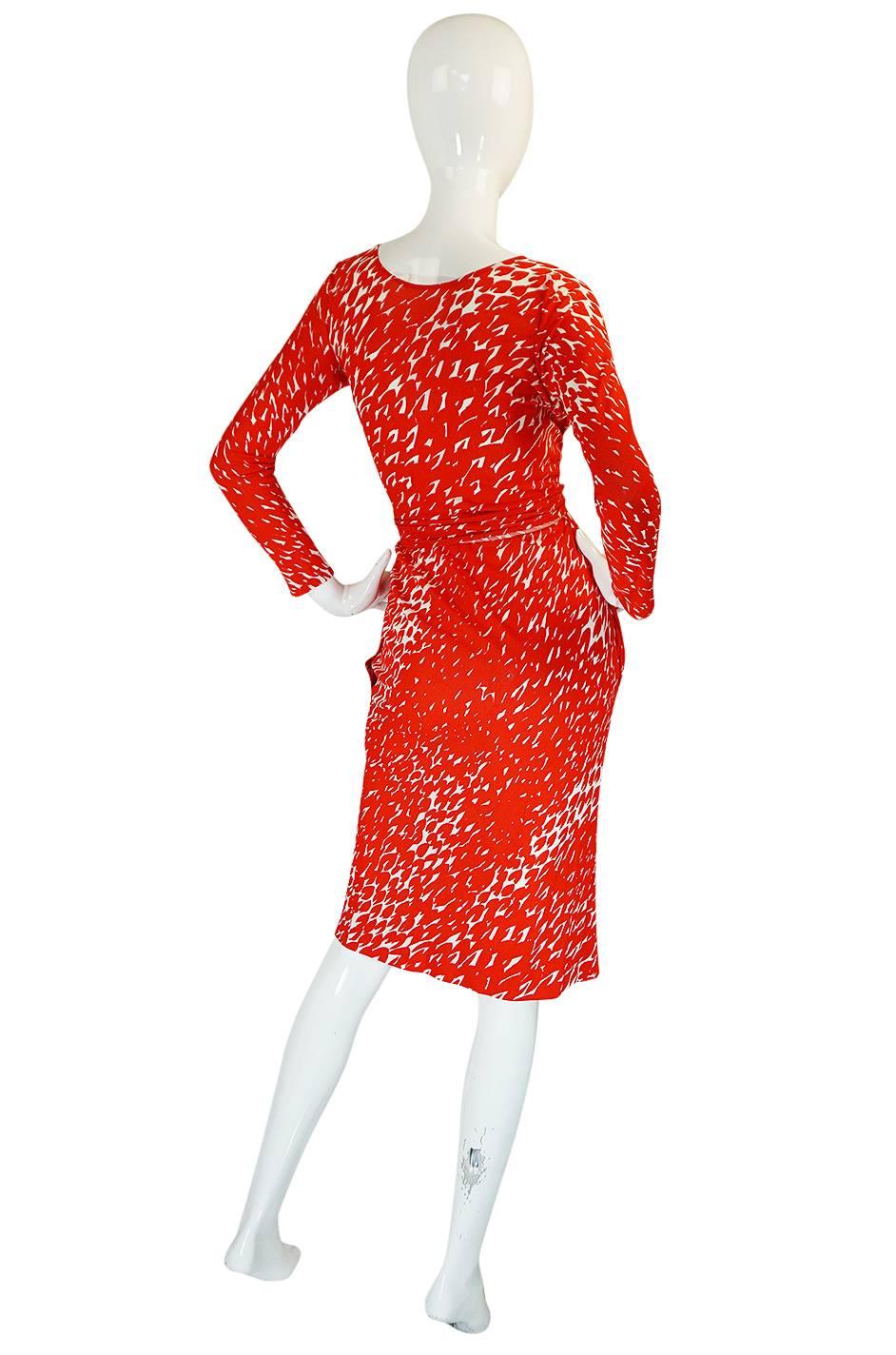 In 1975 Halston introduced menswear and his signature fragrance and he also showed this abstract prints and this fabulous pure red. In the reference pic within the photos here, you see a similar print on a longer more caftan dress. I also found the