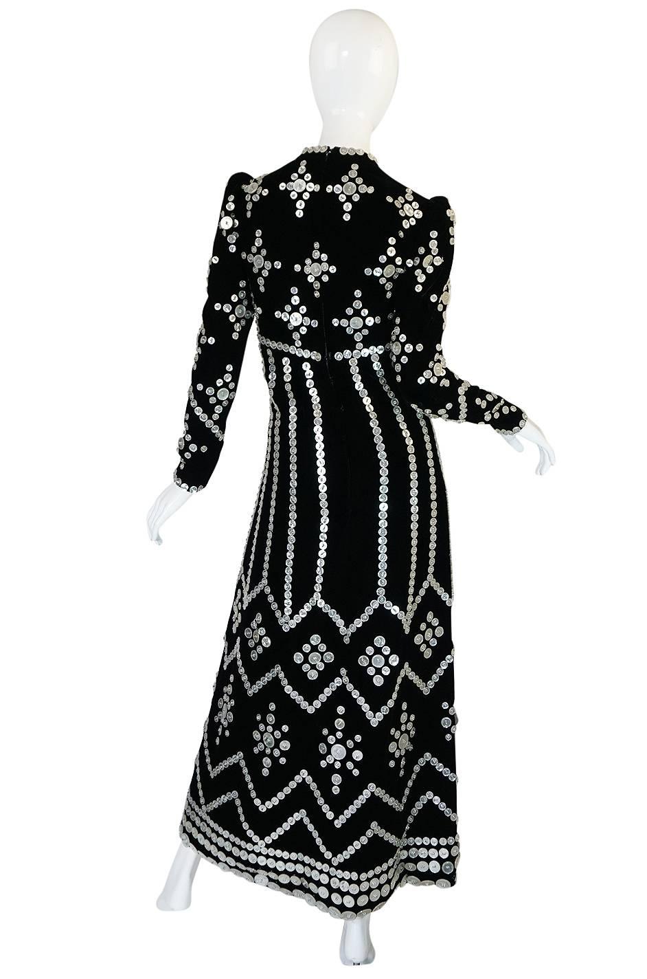 This is a remarkable and extraordinary dress that is really a testament to the one-of-a-kind-treasures that one can only find with vintage. I absolutely adore this futuristic maxi dress that is really a work of wearable art. The combination of cut,