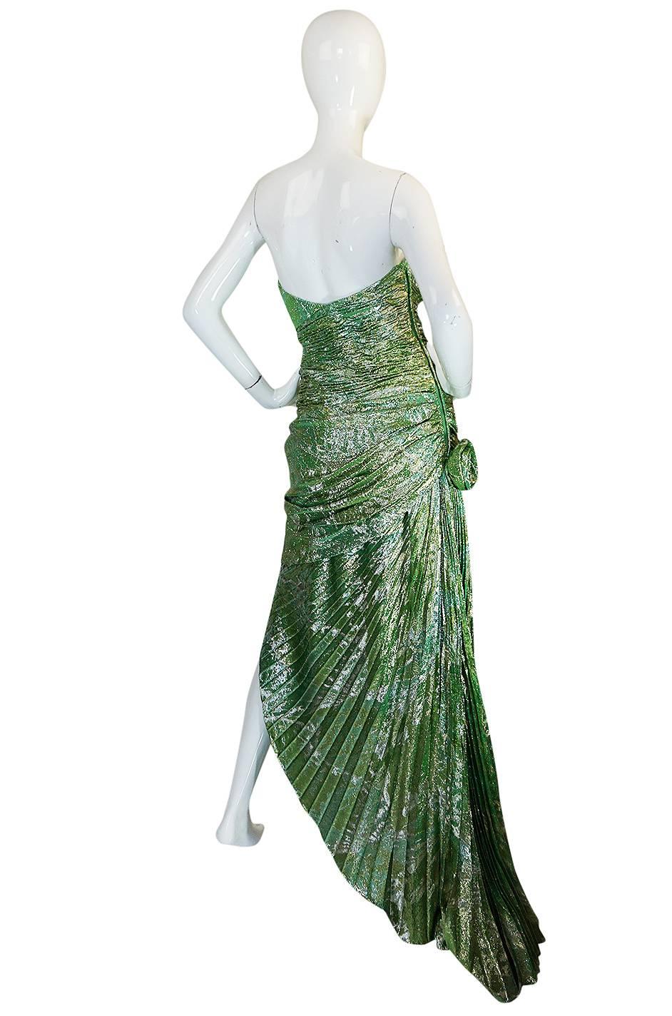 If you have been looking for a statement dress for the season look no further then this incredible Ungaro dress that is absolutely amazing. That dramatic color is the first thing you see - it's an amazing combination of green and gold and the