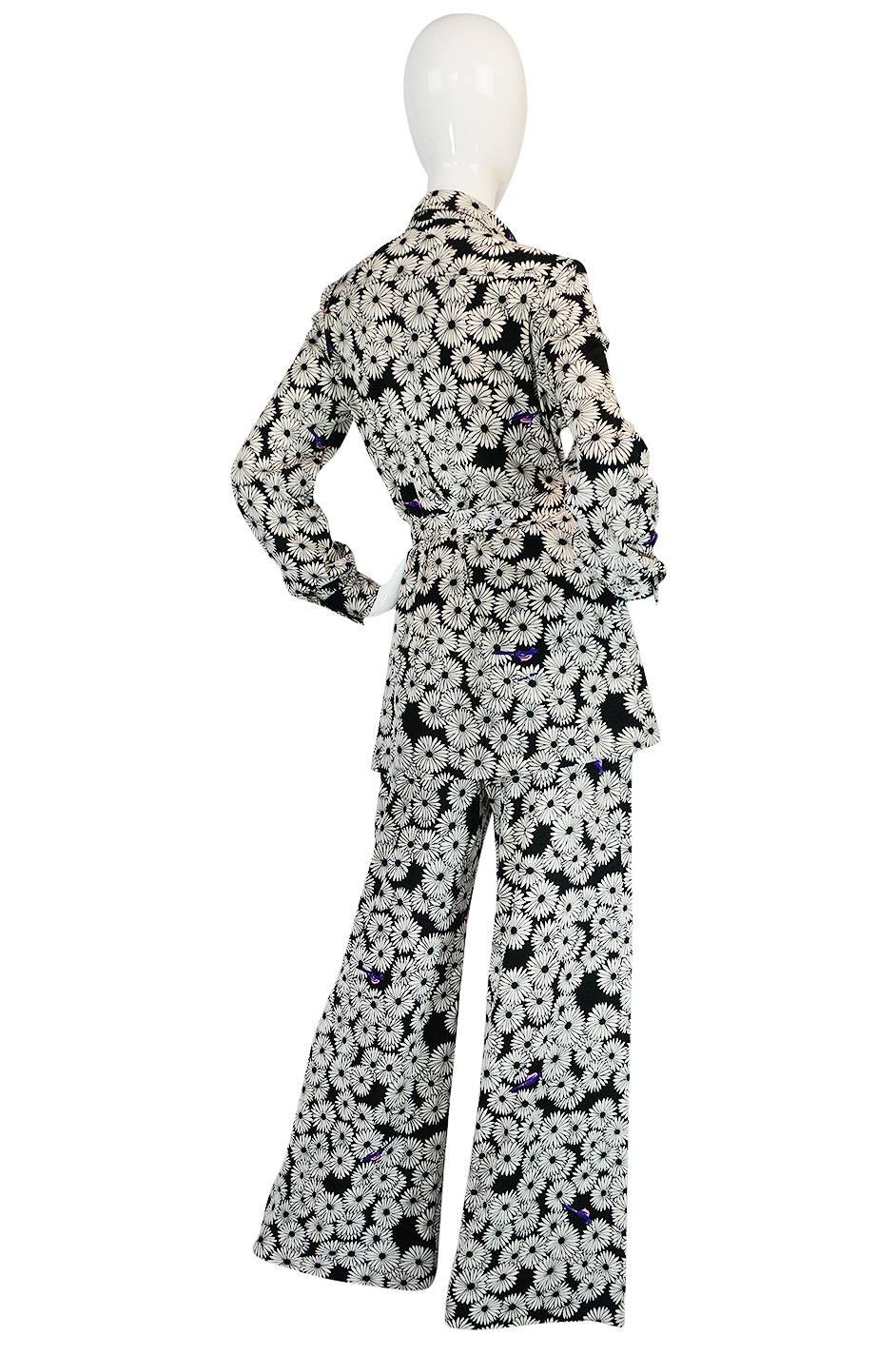 

I am a huge Hanae Mori fan and this jersey pant suit is perhaps not what you normally think of when you think of her work but is fabulous none the less. It is made up of a pair of wide legged pants and button front top with a matching fabric tie.