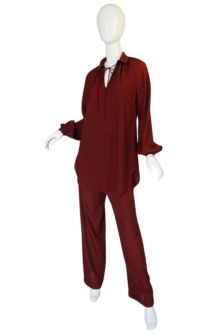 This Halston IV pant and tunic set is made from an easy to care for, easy to wear silky synthetic that is light and easy and that you can wash and wear. The simple, classic design makes it is an easy way to be instantly dressed up and still entirely