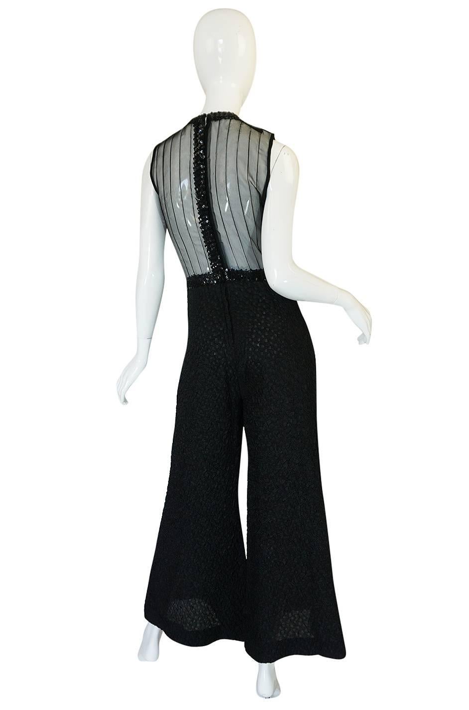 This is am amazing piece and a piece for a brave girl who wants to drop jaws. Its about as risque as you can get and even more so when you think of when it is from since it looks like it could have walked off a runway yesterday. The bodice is made