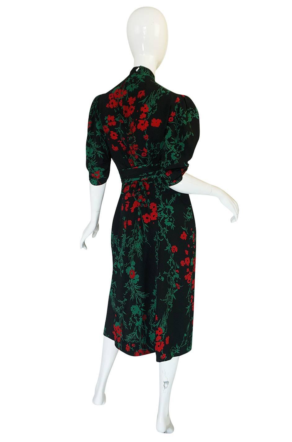 This dress is one of the best 1940s dresses I have seen and is well made and definitely higher end workmanship. It has its Fashion Originators Guild Label but no other. The Guild was formed by a group of designers, manufacturers and actual shop