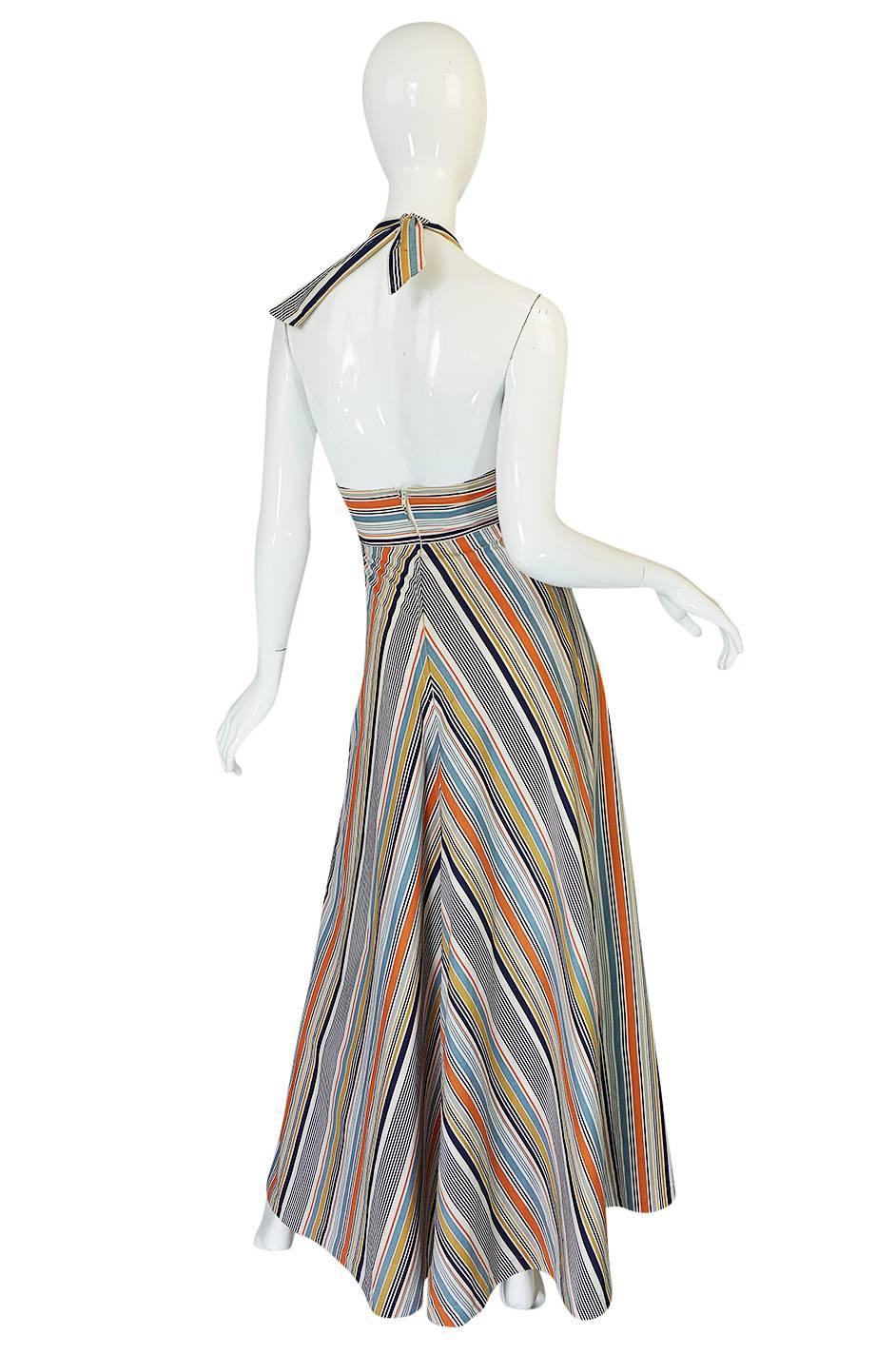 There is just a certain cut and line of a seventies halter that once you find you look for variations of it endlessly. This is that dress. It is super chic and one of those easy to wear pieces that you can just throw into a suitcase and it works for