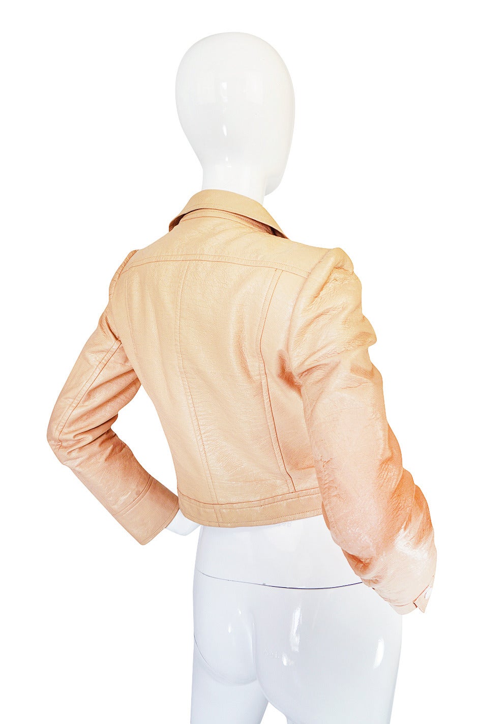 Andre Courreges made cloth and wool versions of this cropped jacket in 1968 and repeated versions of them for his next few collections as they were immensely popular. For the 1971-72 collection he did them in vinyl and showed them over ribbed under
