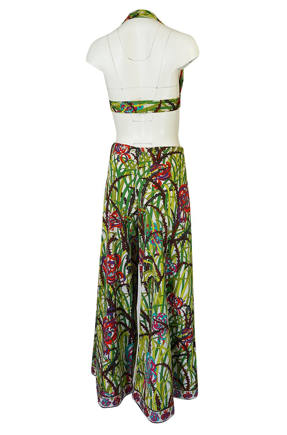 This is an absolutely gorgeous, early 1960s printed Emilio Pucci two piece set with a tie front halter top and a pair of incredible, wide leg matching pants. It is made of light, cotton jersey that has just a touch of nylon woven into it. This gives