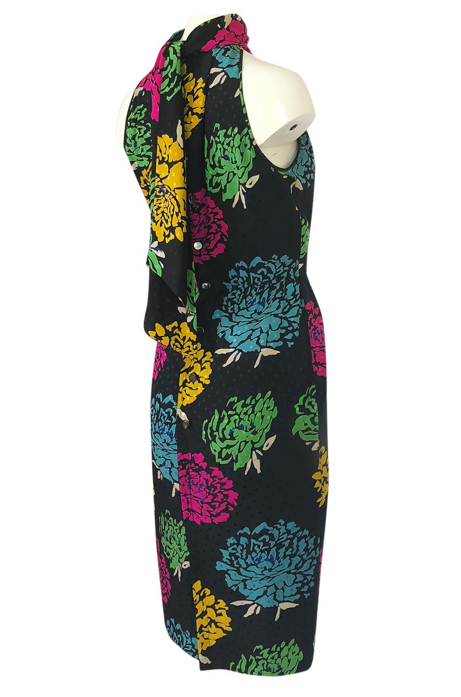 This is a fabulous little Emanuel Ungaro dress with the prettiest floral print running over its surface. It somehow manages to be dramatic, sexy and yet pretty and sweet all at once. Ungaro started out as a designer who did very structural and