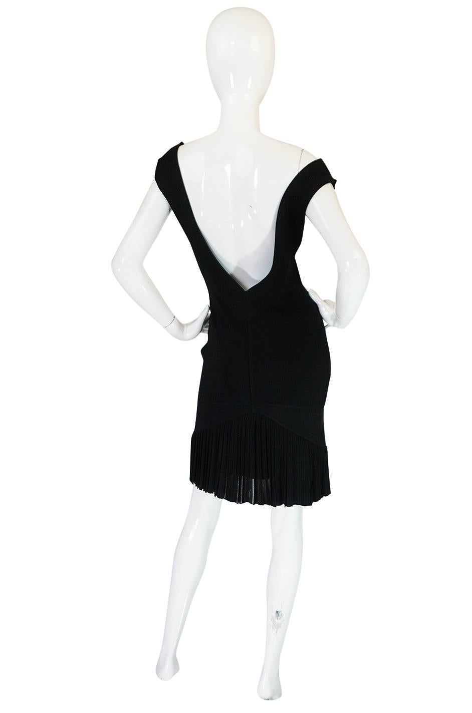 Insanely sexy, this Azzedine Alaia dress from the  spring 1990 collection has that in your face sensuality  that Alaia is known for. It is made form his signature bandage knit so it clings and hugs the body and your every curve. This one is plunged