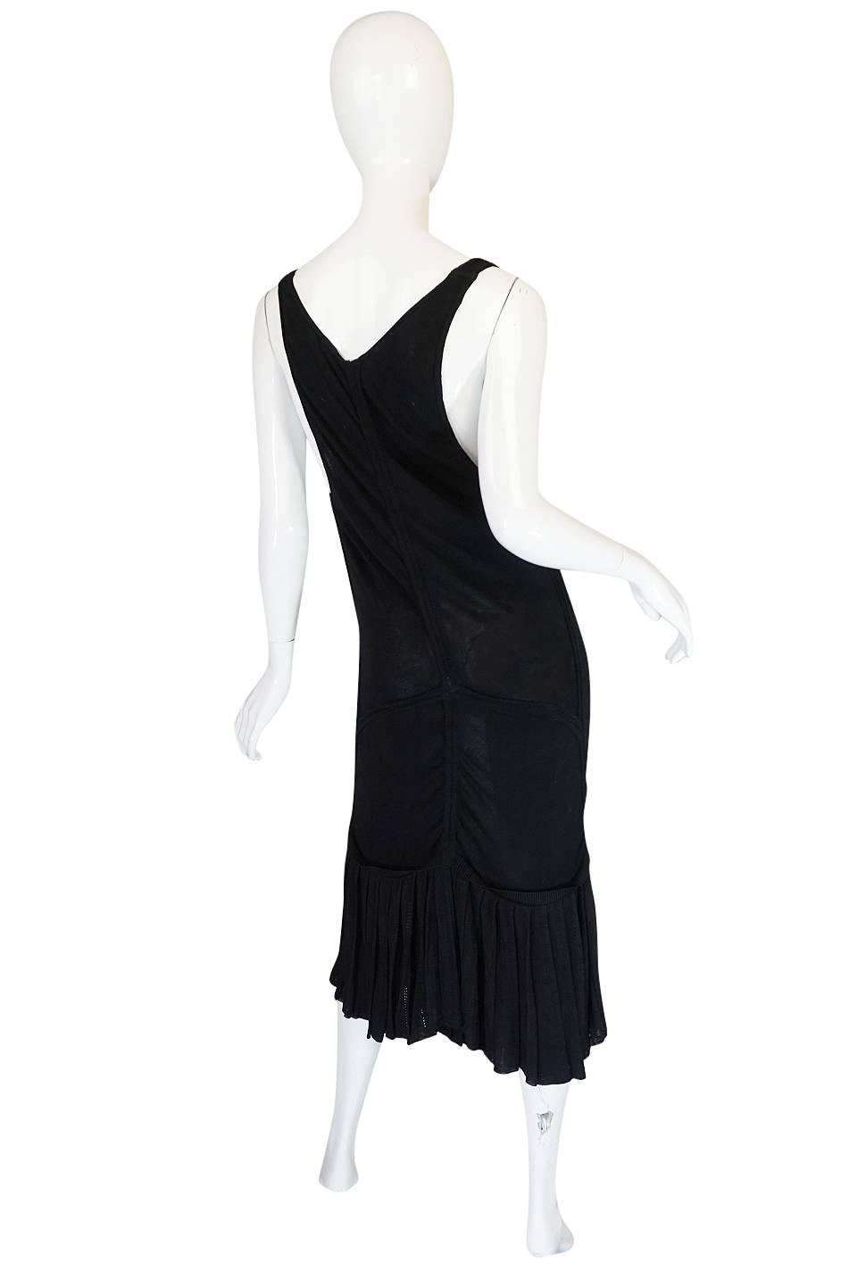 Insanely sexy, this low scooped front Azzedine Alaia dress from the 1990 collection has that in your face sensuality  that Alaia is known for. It is made form his signature bandage knit so it clings and hugs the body and your every curve. This one