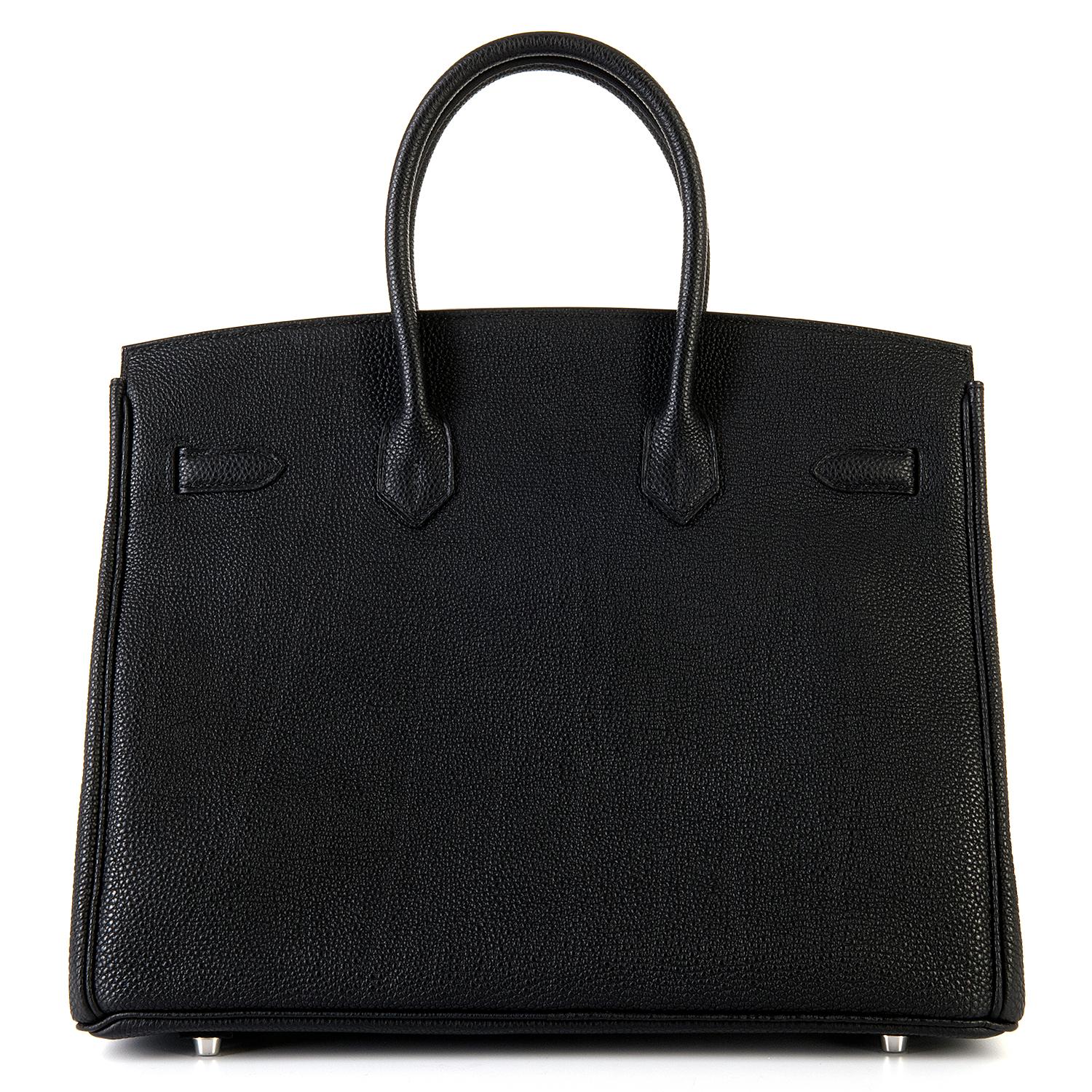 Never worn, this beautiful Black 35cm Birkin bag, finished in rain resistant Fjord leather is accented with Silver Palladium hardware. The bag comes complete with its key-fob, keys, padlock, dust bags, rain cover & it's original Hermes box and