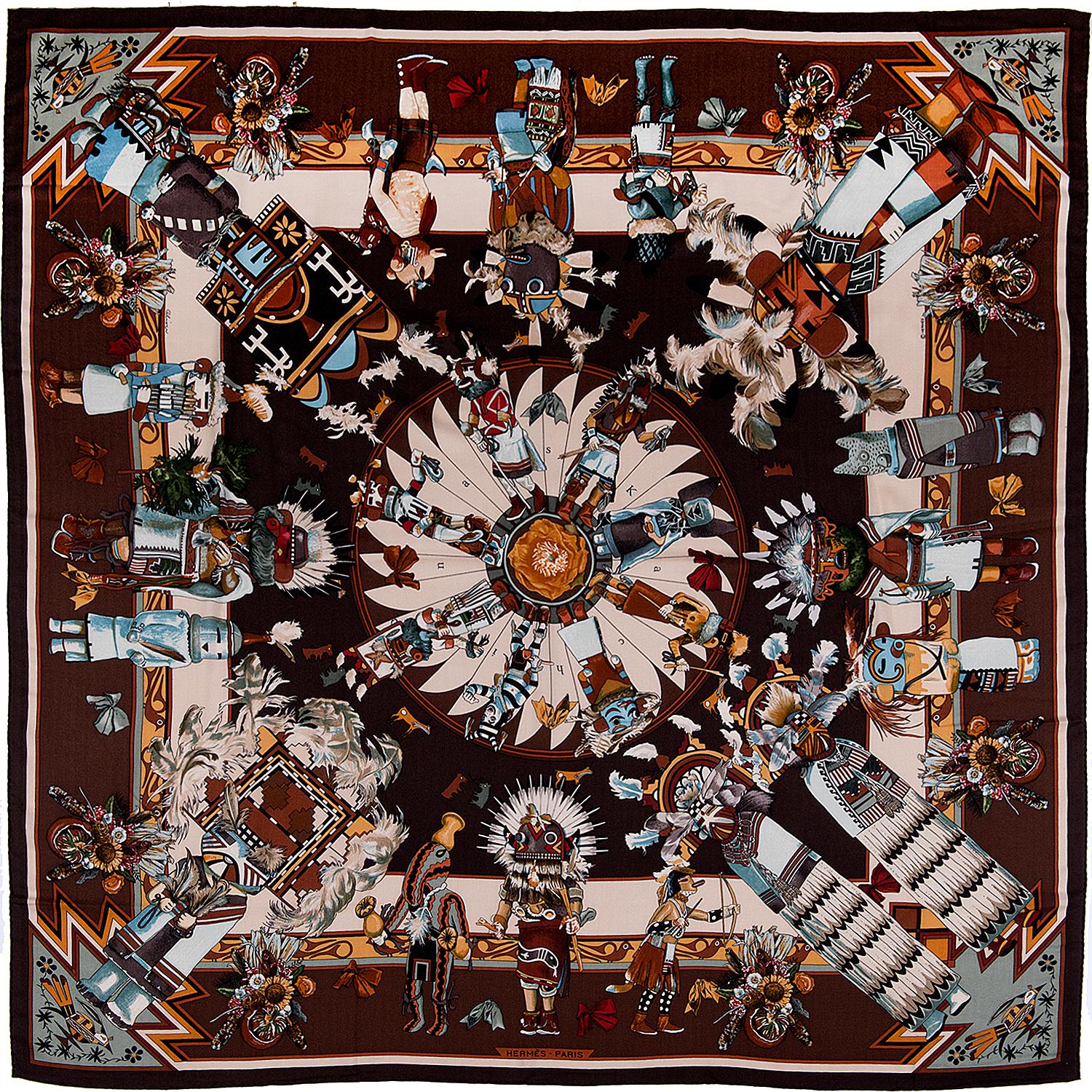 This fabulous Vintage Silk & Cashmere Shawl, 'Kachinas' was designed by Kermit Oliver in 1992. On a chocolate brown ground, the Shawl measures 54in. x 54in. - comes with it's Hermes box and is in absolutely pristine condition.