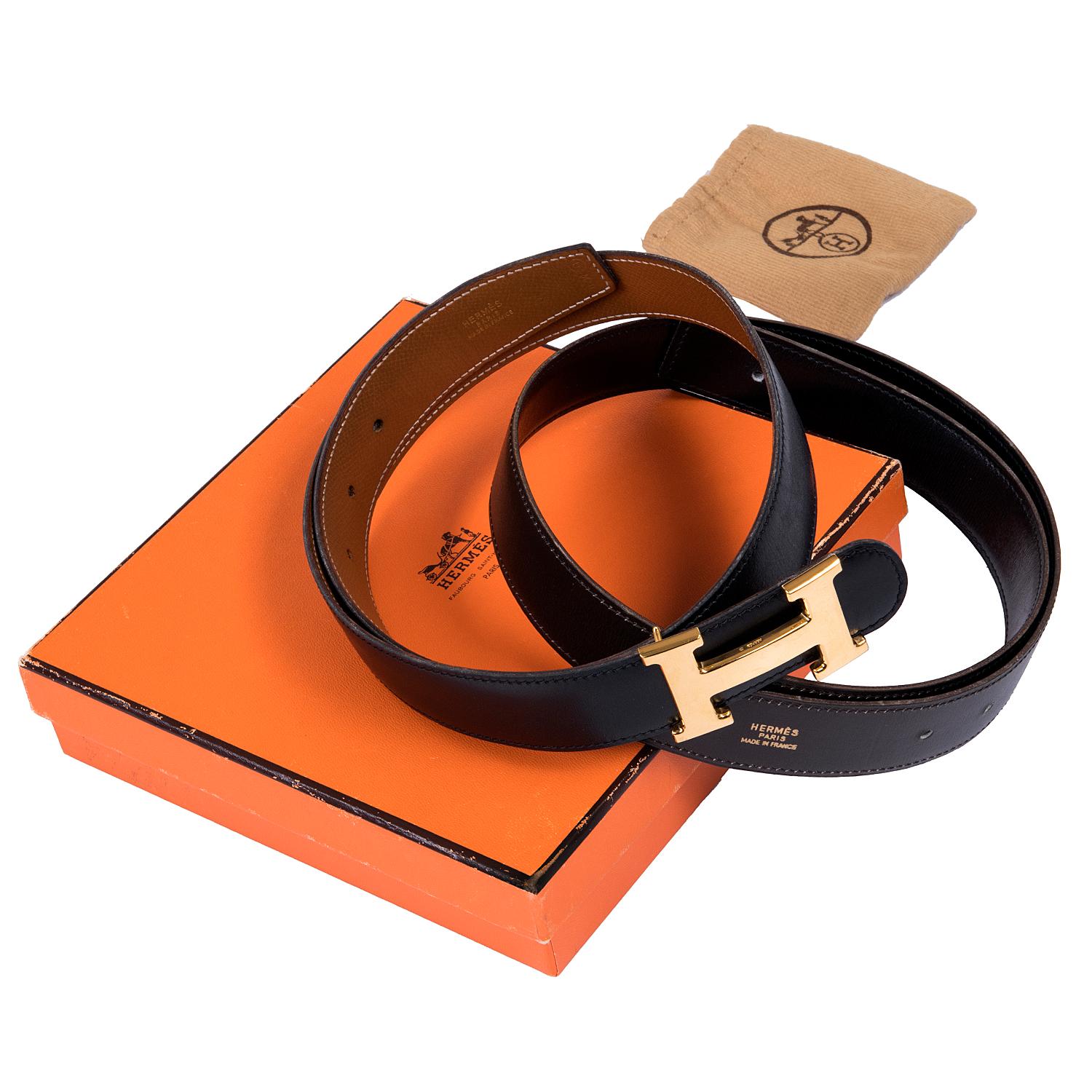 A Real Find !! Two vintage Hermes Reversible leather belts, fitted with the iconic Gold Hermes 'H' Buckle. The belts measure 70cm (28in.) and are interchangeable with the 'H' buckle. The belts come with their original Hermes box and Buckle storage