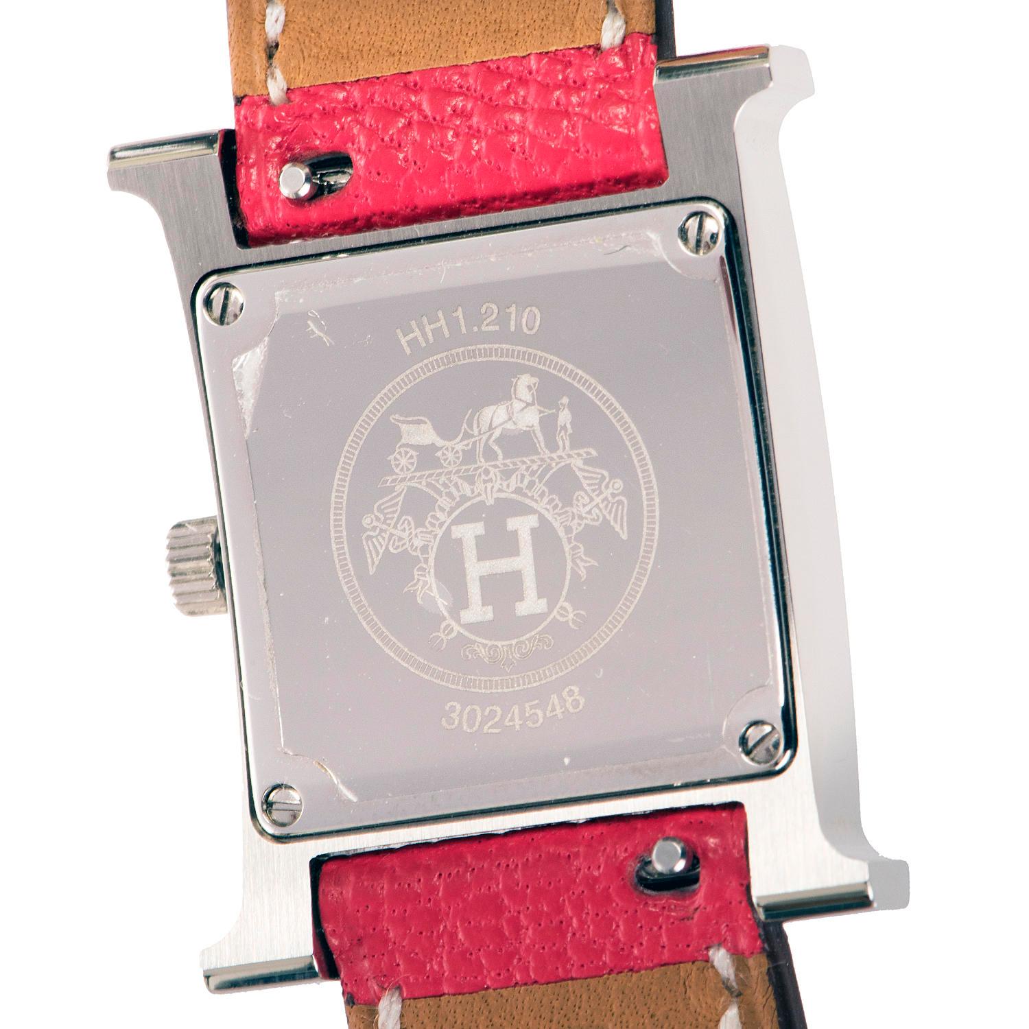 A 'Never- worn' pristine condition Hermes 'Heure H' 21mm double tour Palladium silver lady's Quartz wristwatch. Numbered 3024548 and bearing the Hermes date stamp P in a square, the Swiss made movement has a white dial with a silver palladium case,