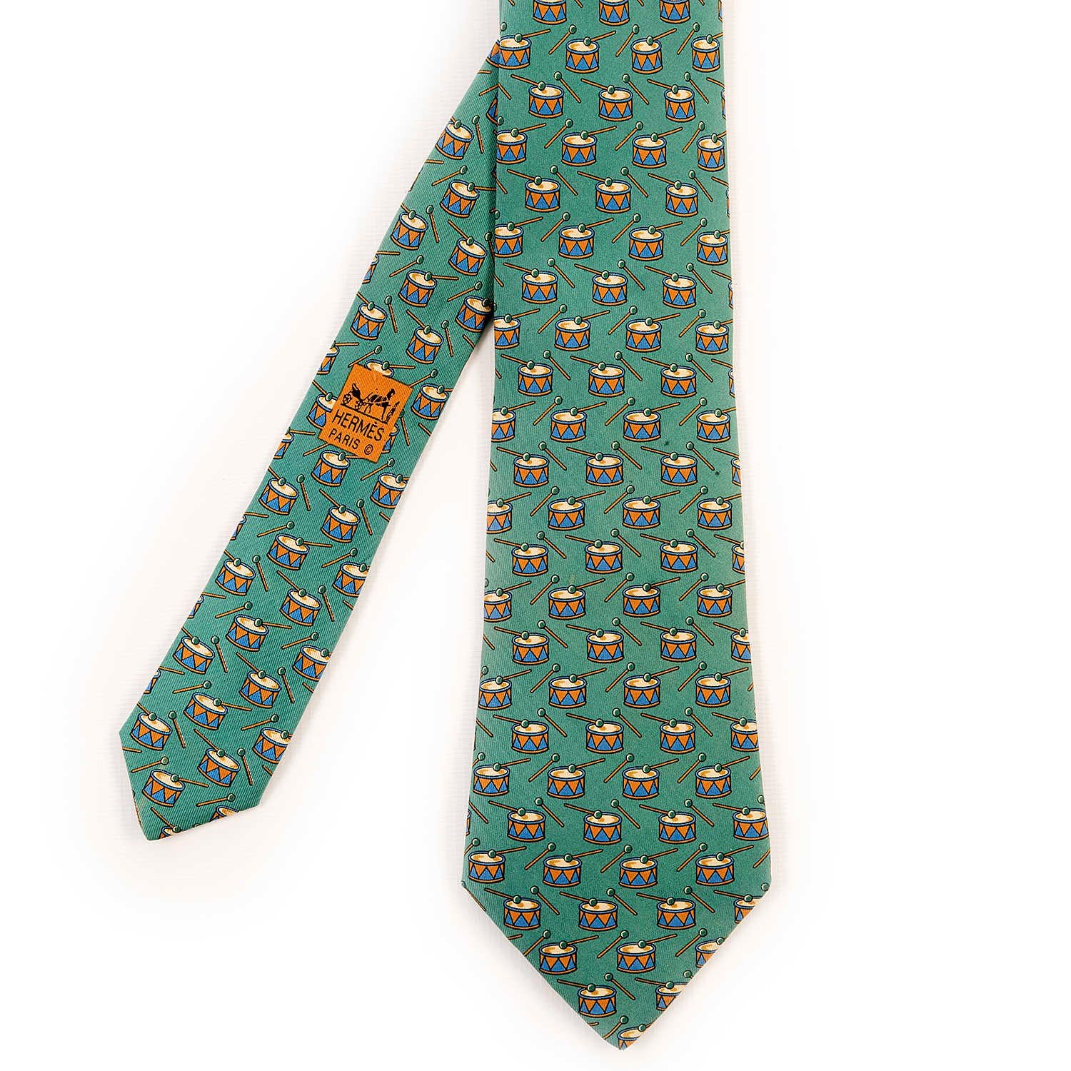 A delightfully whimsical Hermes Vintage Silk Tie, 'Drummer Boy' in absolutely pristine condition, on a mid-green ground.