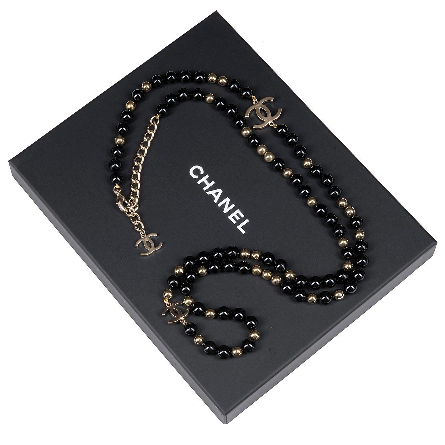 This Beautiful Tres Chic Chanel Necklace has gold and black baubles of varying size, embellished with large and small gold 'CC' Logos. Measuring 44in. long the necklace can be doubled and worn as a shorter drop necklace for different occasions. The