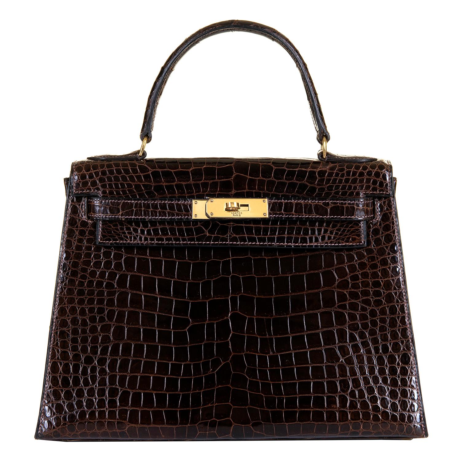 The optimum size, 28cm. This Hermes Vintage Chocolate Brown Porosus Crocodile Kelly Bag, is in excellent, pristine condition throughout, and is beautifully accented with Gold-plated hardware. This much loved bag, from a private collection in