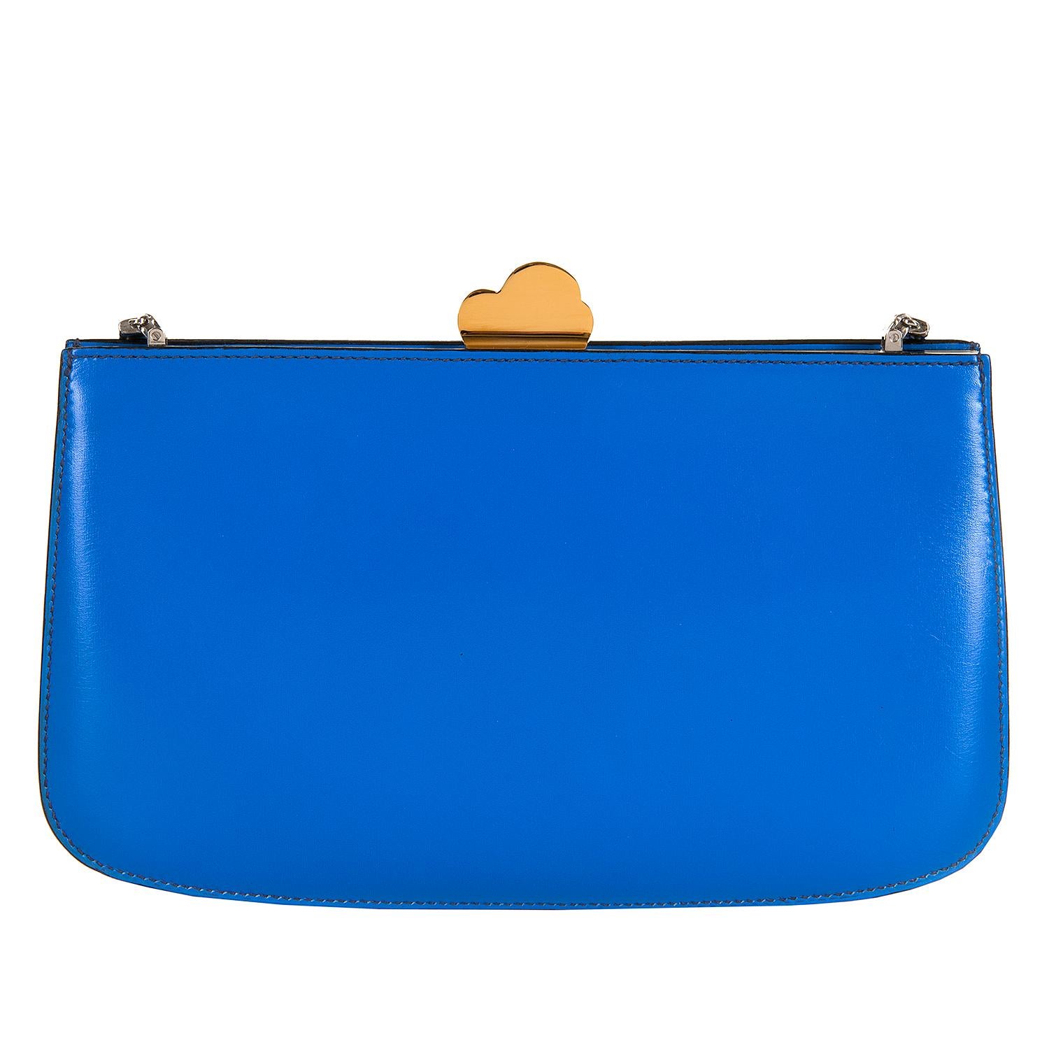 This Very rare Hermes Bag, 'Sac a Malice' is in absolutely pristine condition. Finished in Azur Blue calfskin, overlaid with various  coloured Hermes leathers, to create a moving cruise ship, with the clouds of steam finished in gold-plated mounts,