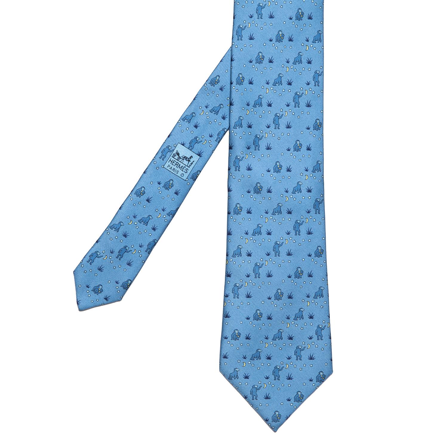 This amusing Vintage Hermes Silk Tie features a Chimpanzee reaching for the moon which magically becomes a banana - IF ONLY ??? In pristine condition the motif is on a light blue ground.