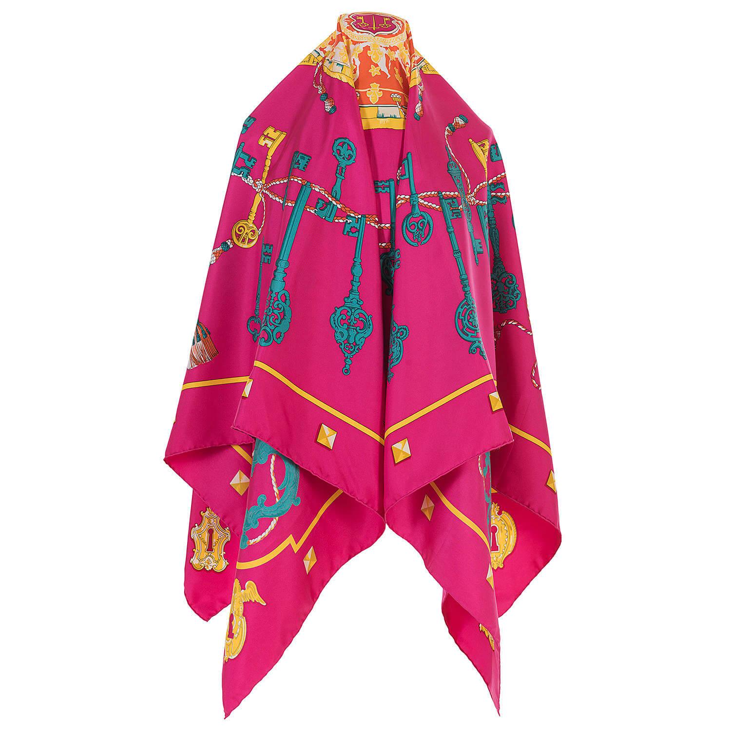 An absolutely pristine silk Shawl, scarf by Hermes. 'Les Clefs' by one of Hermes favourite designers, Caty Latham, was first released by Hermes in 1965. This rare, vintage design with stunning rich colours - yellow, orange, emerald green, white on a