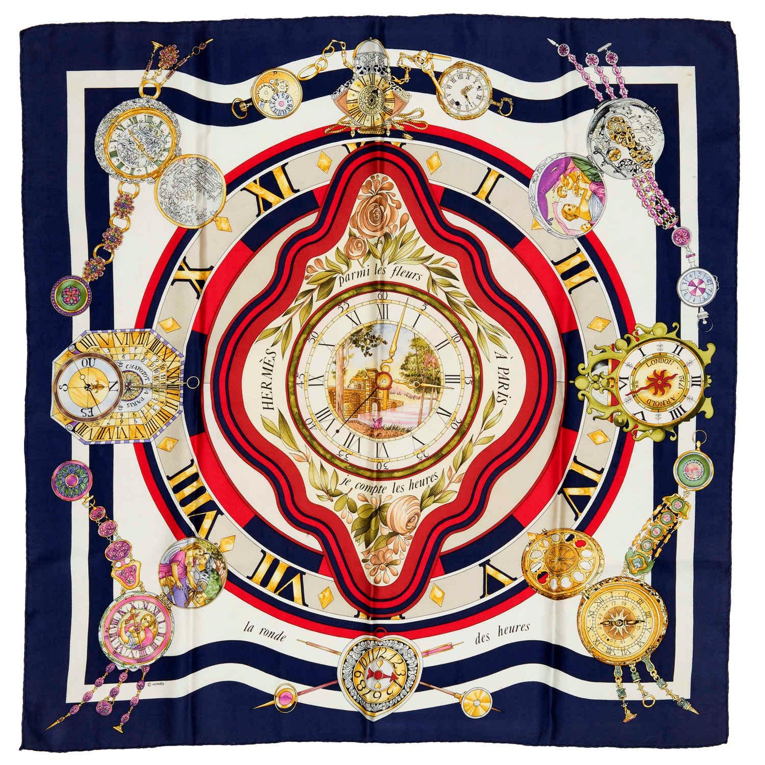 'La Ronde des Heures' - a classic Hermes Silk Scarf designed by Loic Dubigeon in 2000. This rare Hermes 'Millennium'  celebration scarf is in sumptuous colours with a Navy Blue Border with Gold & Grey Ground.