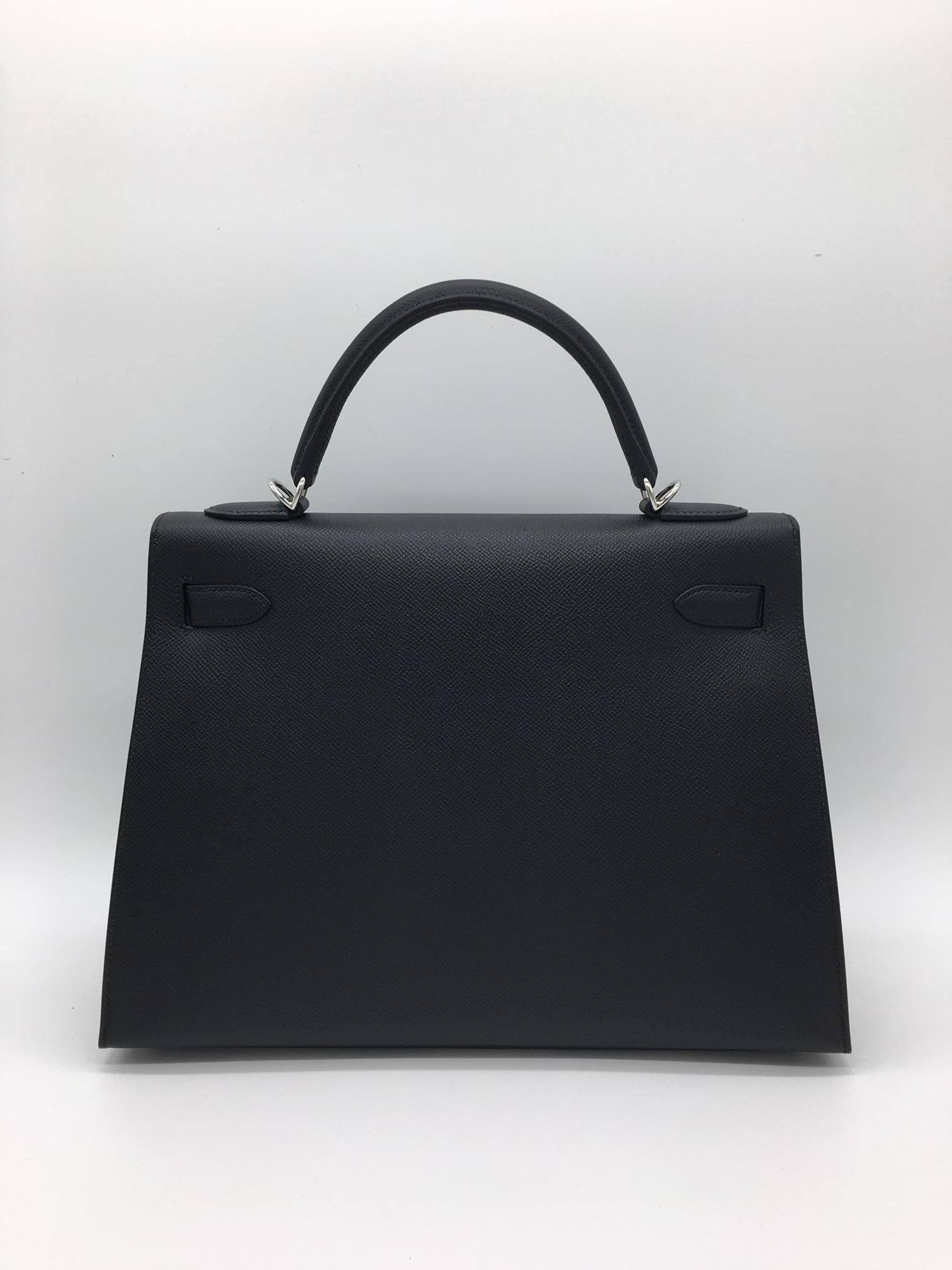 Probably one of the most glamorous and famous Hermes bags – a Black Kelly with Palladium Hardware in the structured Sellier design with external stitching which gives it a particularly distinctive look. This is a 32cm Black Kelly Sellier in Epsom