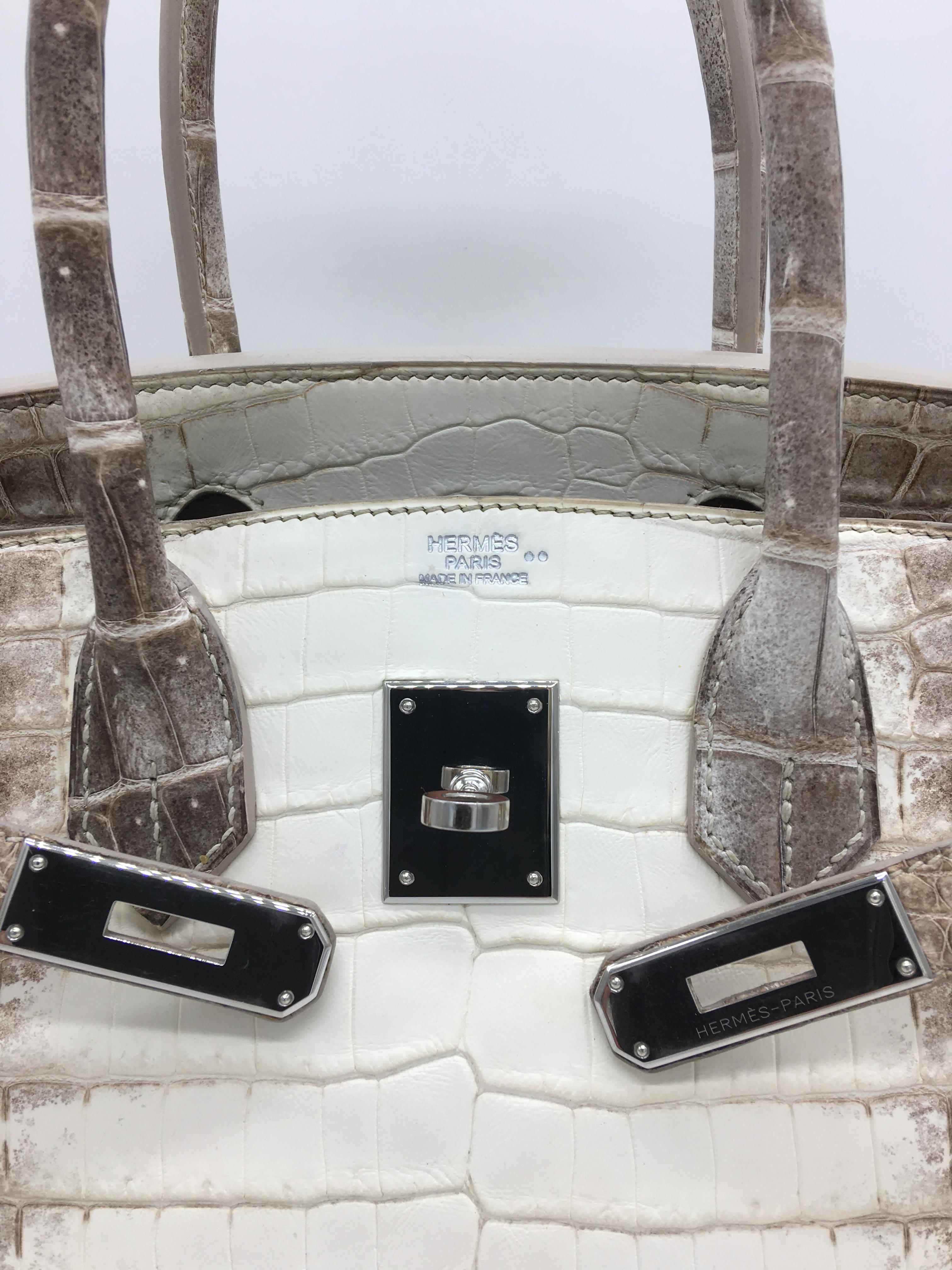 Long considered the Holy Grail of Birkins this 30cm Himalaya in Matte Crocodile with Palladium hardware is absolutely beautiful!  The time consuming process of achieving the colour graduation from from white to cream to grey and the craftsmanship