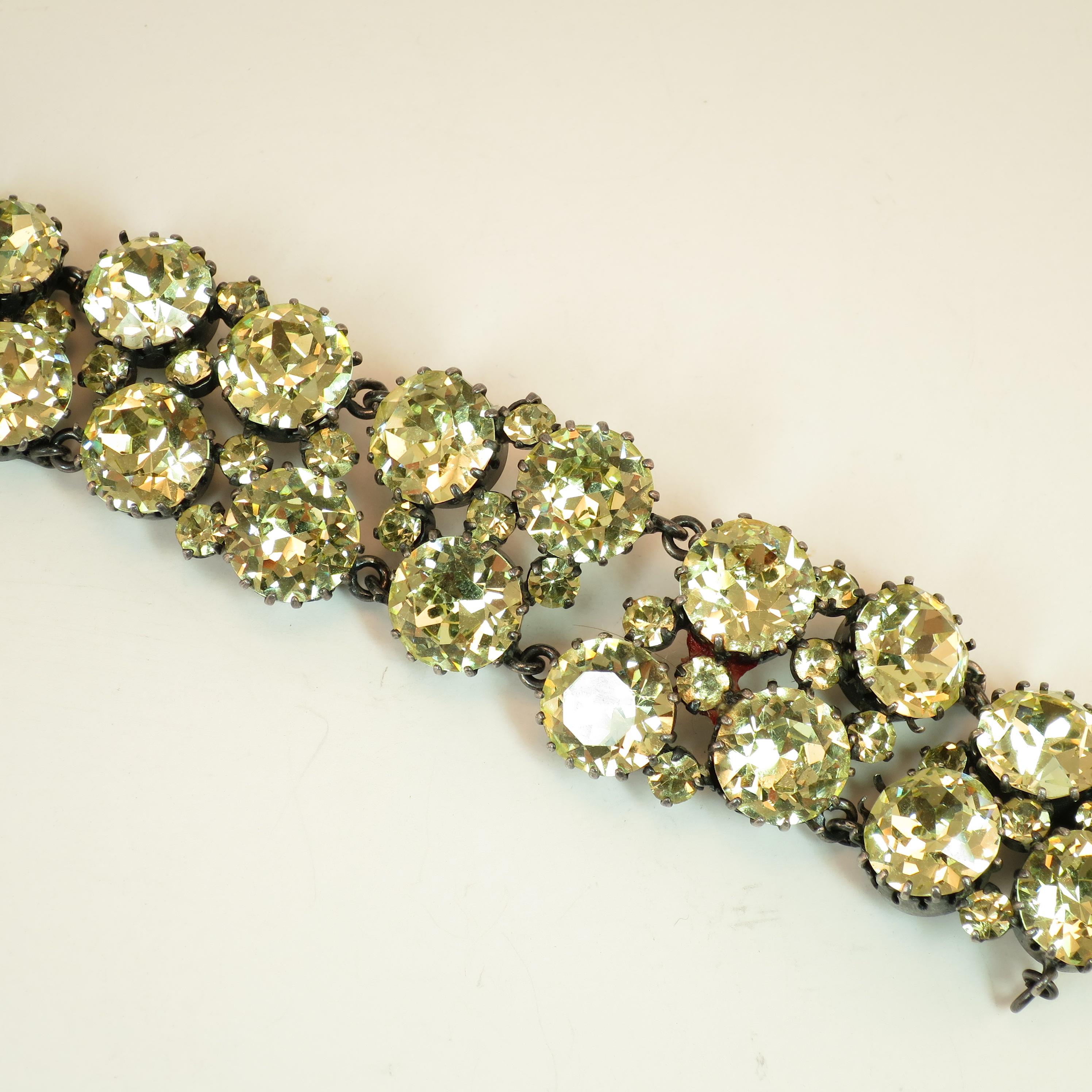 Offered here is an Austrian hand-fashioned crystal link bracelet from the 1930s. The raison d'etre of this glittering bracelet is the large intricately-faceted 