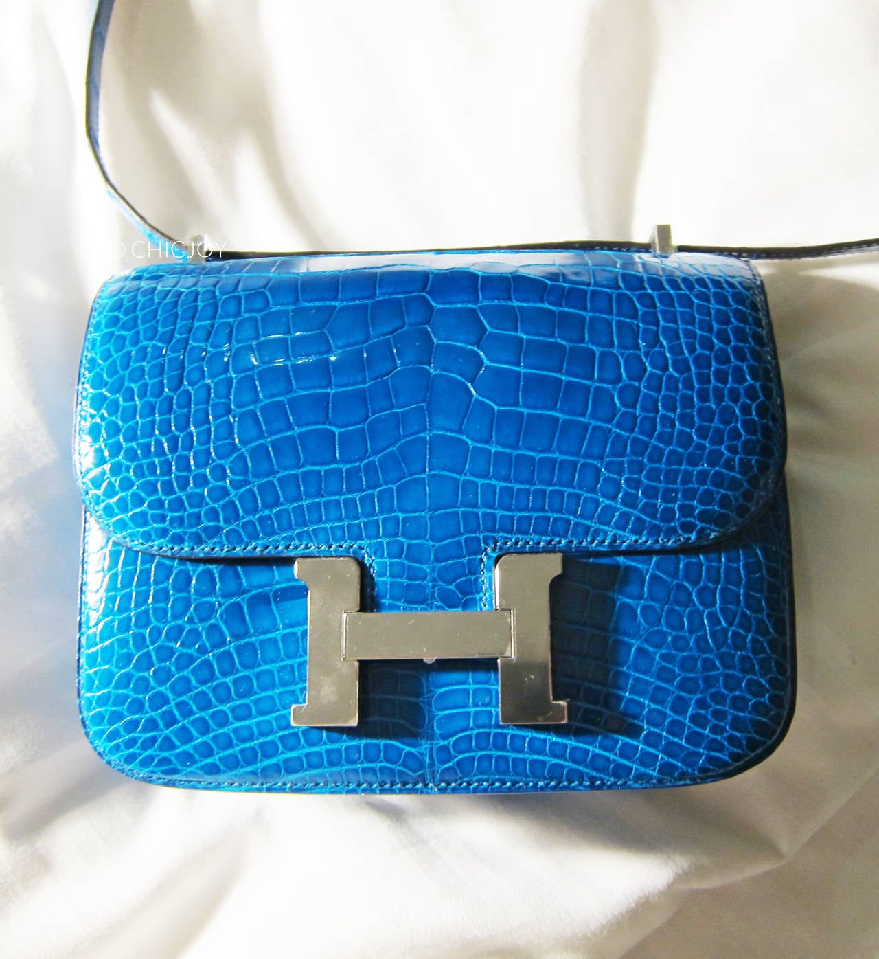 Hermes Mini Blue Izmir Constance 18cm Alligator Lisse Crocodile Jewel 

Store Fresh.  Brand New in Box.  Never Carried.  With plastic on hardware.  Comes full set with a sleeper for the bag, Hermes ribbon, and original box.  Just like you walked