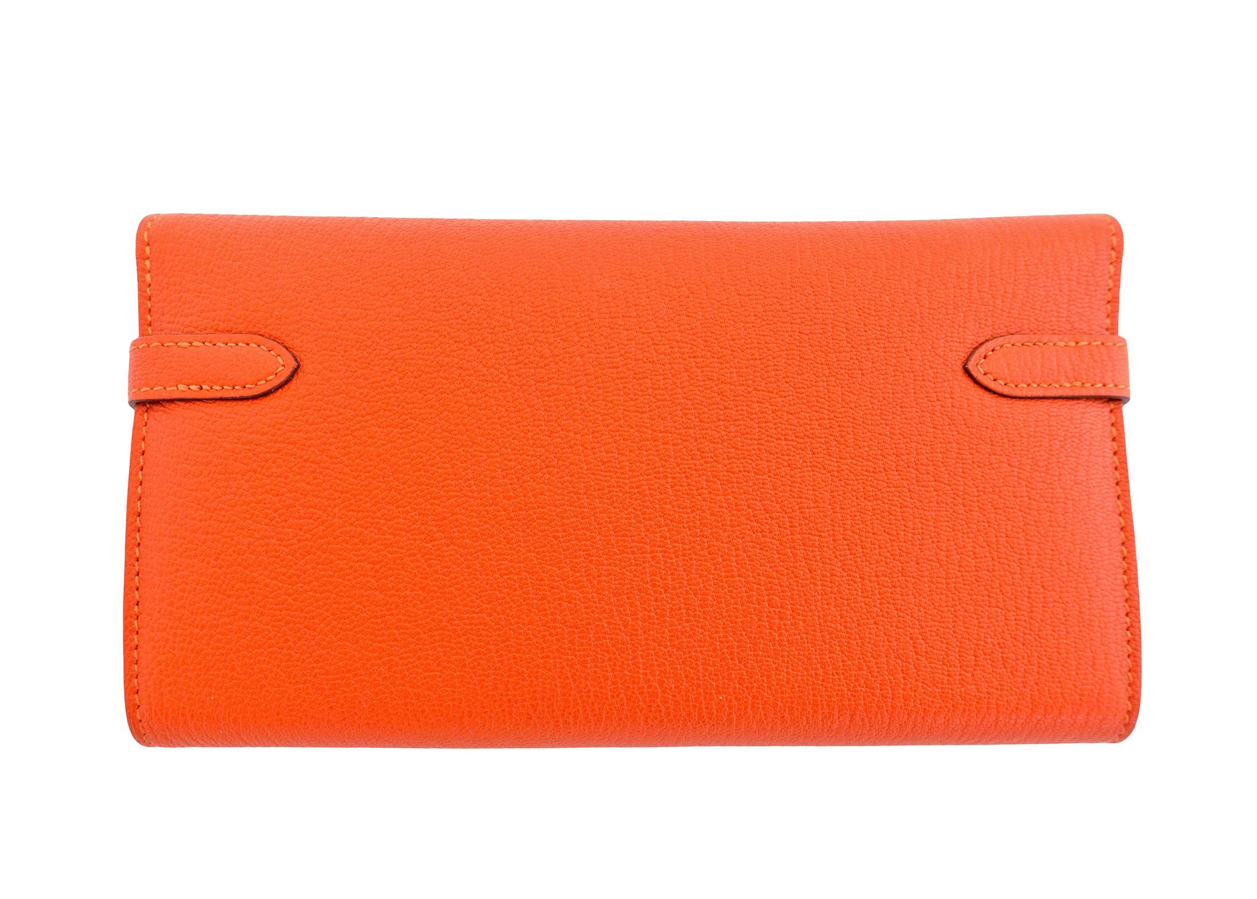 Hermes Feu Orange Kelly Wallet Chevre Palladium PHW Iconic
Store fresh. Pristine Condition.  
Perfect gift! Coming full set with Hermes box and ribbon.  
Feu Orange is a gorgeous orange.
So luxurious in Chevre skin with a slight sheen.
A