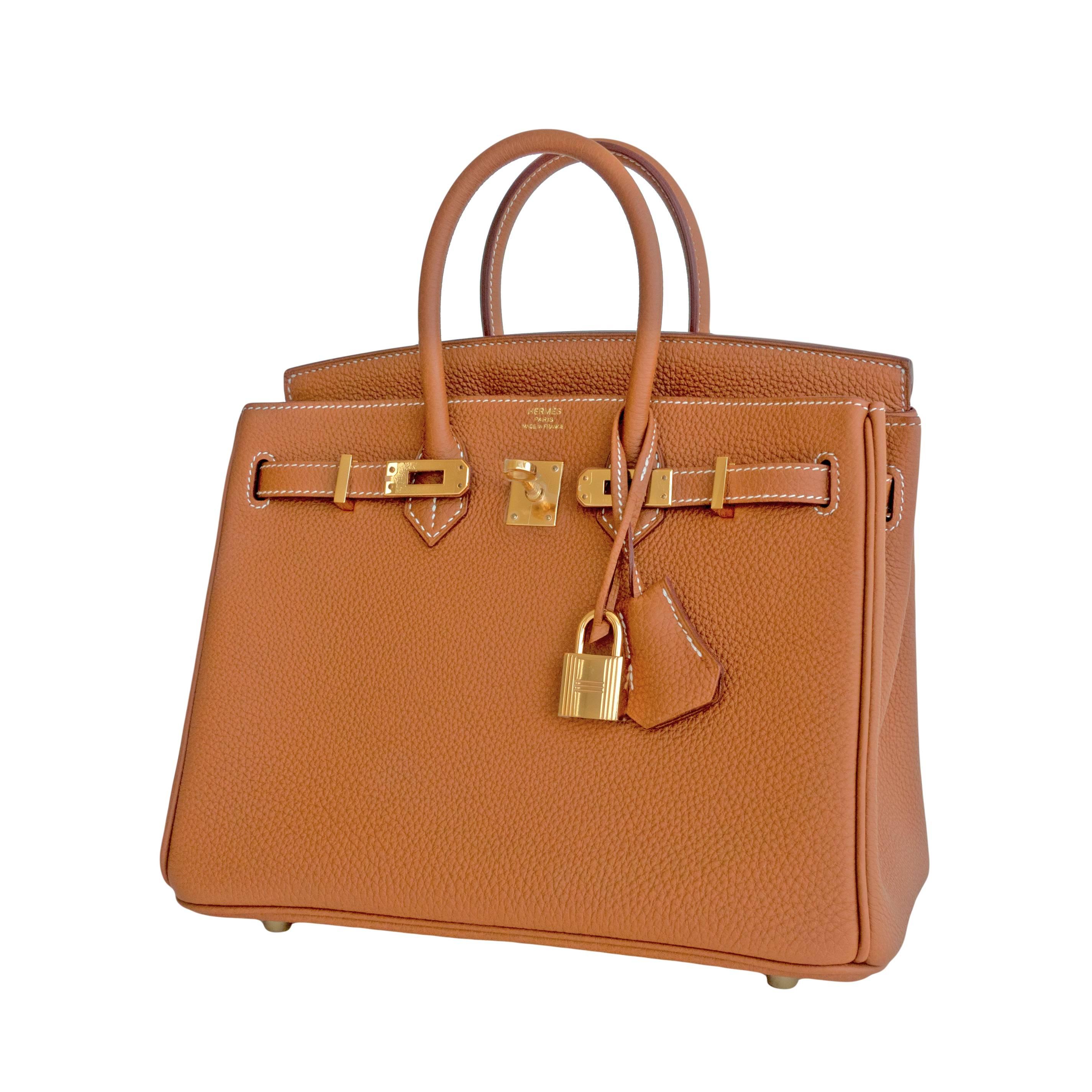 Hermes Gold Baby Birkin 25cm Camel Togo Gold GHW Jewel 
Brand New in Box. Store Fresh. 
Perfect gift! Comes full set with keys, lock, clochette, a sleeper for the bag, rain protector, and Hermes box.
The Gold 25 Birkin is a highly coveted and