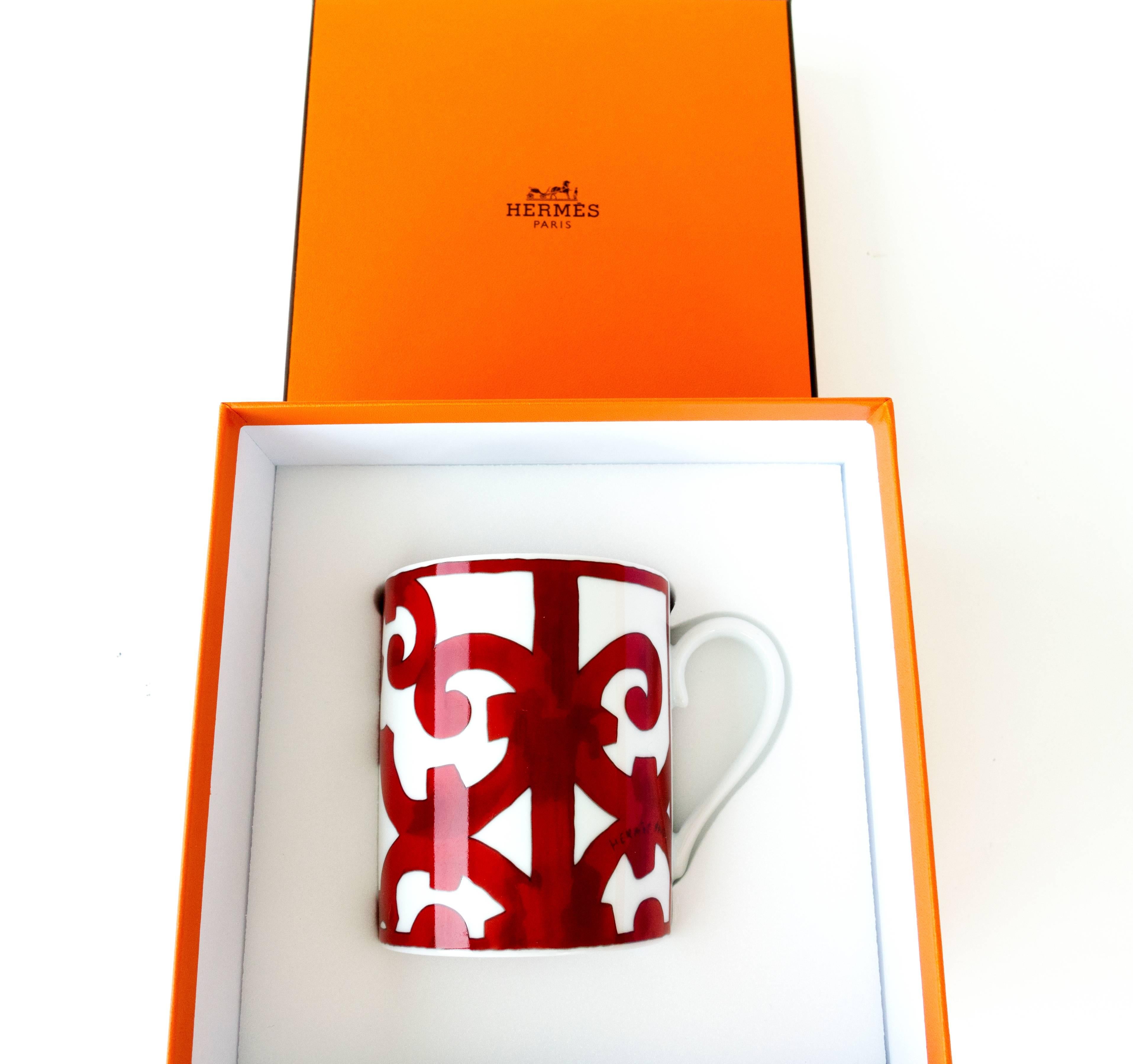 Hermes Balcon du Guadalquivir Porcelain Coffee Mug
Brand New in Box.  Store fresh.  Pristine condition.
Below $180 retail including tax where we are.
Perfect gift!  Comes with Hermes mug gift box set.  
Bold graphic red and white porcelain