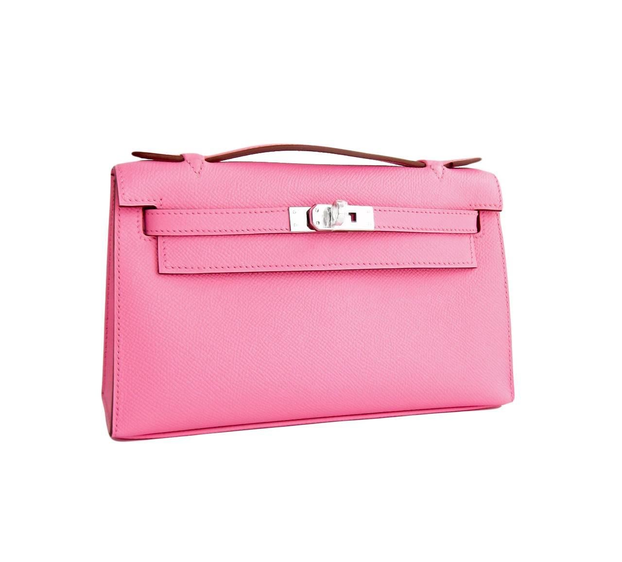 Hermes Rose Confetti Pink Epsom Kelly Pochette Clutch Bag Love  
Brand New in Box.  Store fresh.  Pristine condition (with plastic on hardware).  
Perfect gift!  Coming in full set with Hermes sleeper, box and ribbon.
This precious Kelly Pochette