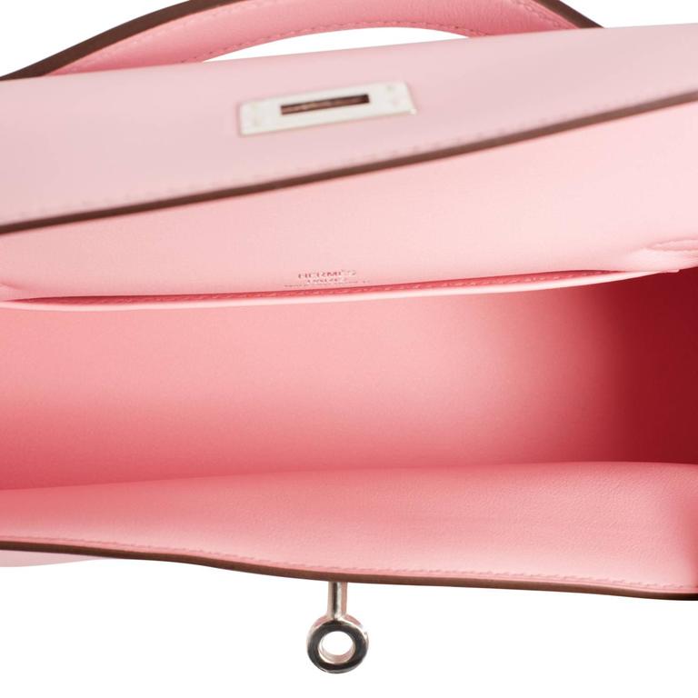 A ROSE SAKURA SWIFT LEATHER KELLY POCHETTE WITH PALLADIUM HARDWARE, HERMÈS, 2019, 21st Century, bags, Christie's