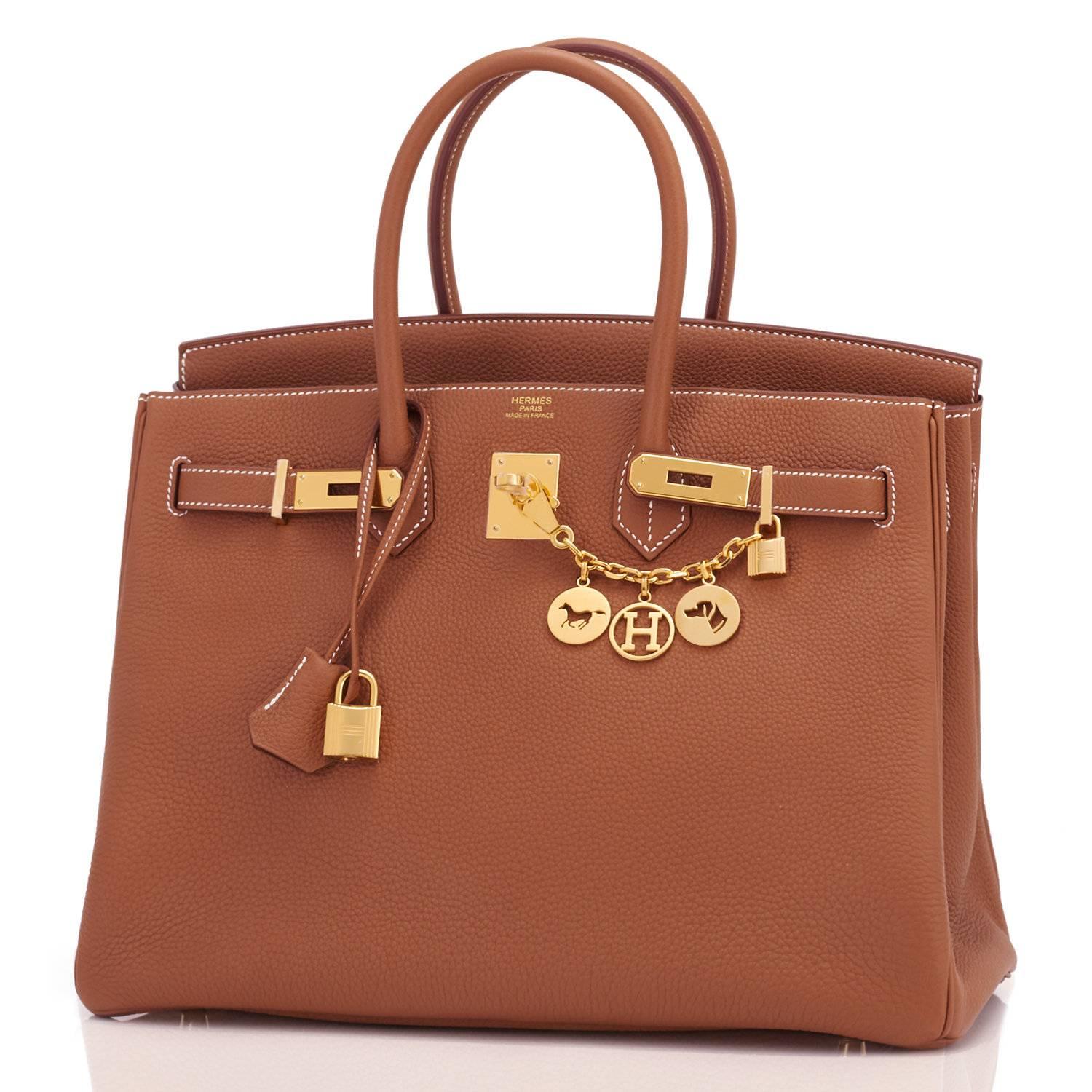 Hermes Gold Togo Camel Tan 35cm Birkin Gold Hardware Iconic 
Brand New in Box.  Store Fresh. Pristine Condition (with plastic on hardware). 
Perfect gift! Comes with lock, keys, clochette, sleeper, raincoat, and Hermes box and ribbon.
Gold is a