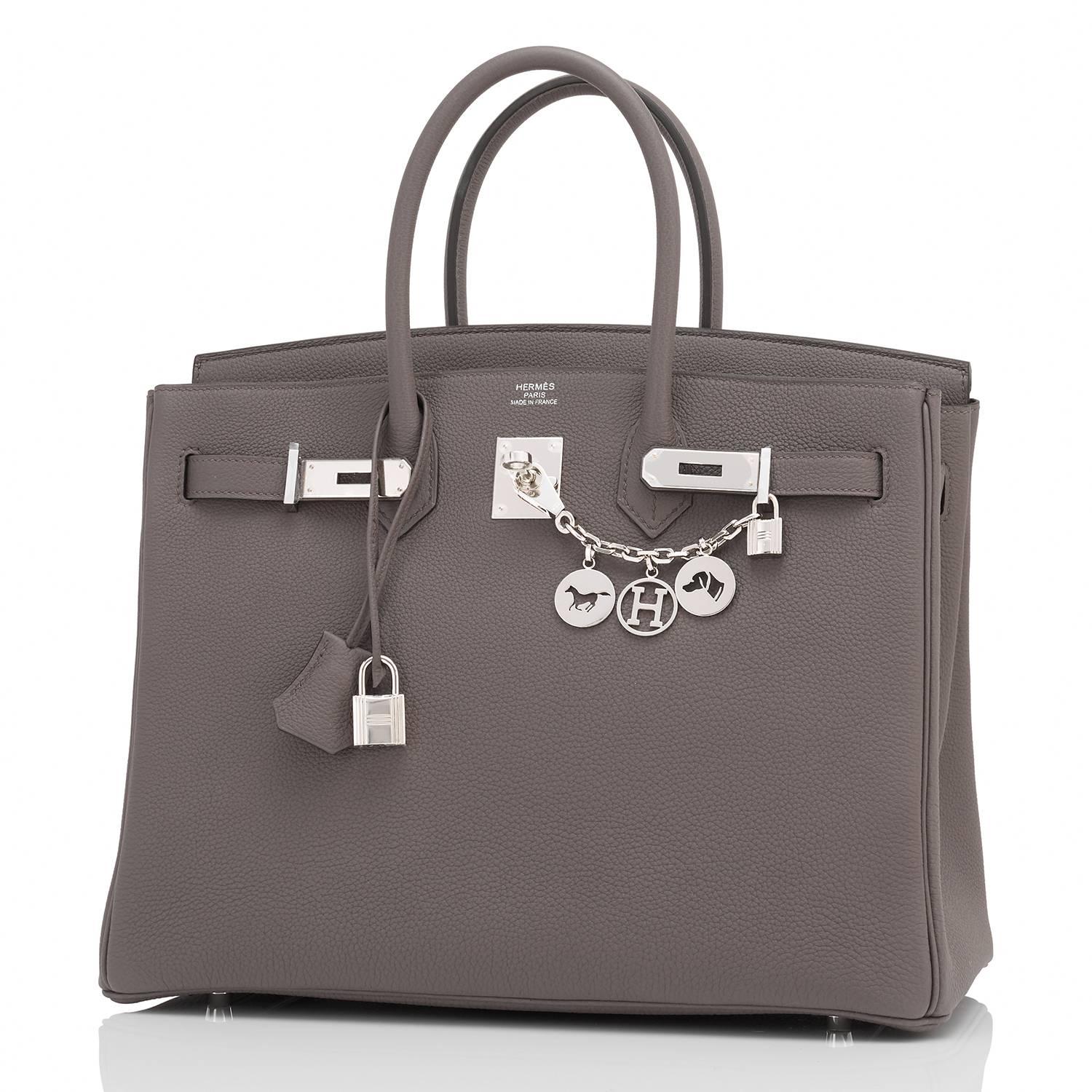 Hermes Etain Togo 35cm Birkin Palladium Hardware
Brand New in Box. Store Fresh. Pristine condition (with plastic on hardware).
Perfect gift! Comes with keys, lock, clochette, a sleeper for the bag, rain protector, and orange Hermes box.
Etain