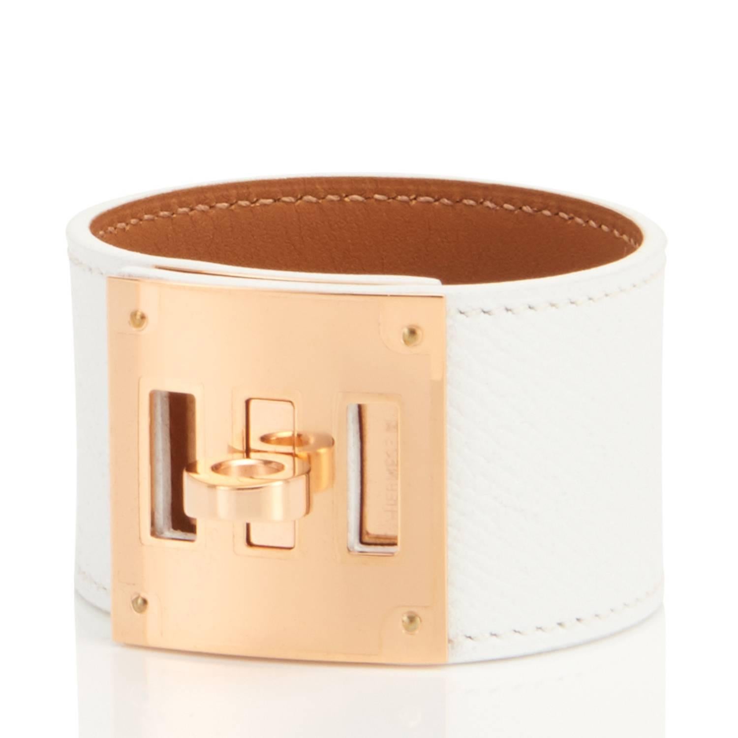 Hermes White Epsom Kelly Dog Leather Cuff Bracelet with Gold Hardware
Brand New in Box.  Store Fresh. Pristine Condition (with plastic on hardware)
Perfect gift! Comes with velvet pouch, Hermes box, and ribbon.
So chic and fresh!
White Epsom leather