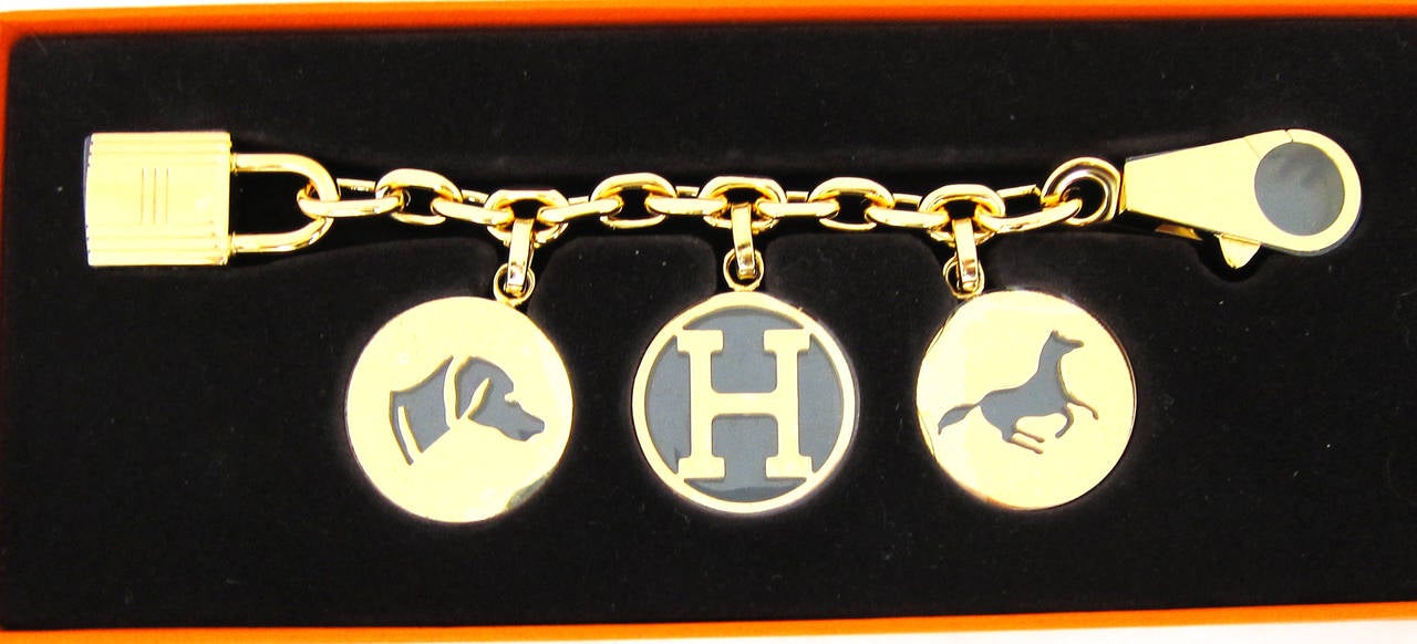 Hermes Breloque Charm Gold GHW Bag Charm for Birkin or Kelly

Discontinued  and were not available for podium order for Fall 2015
Brand New in Box with plastic protective stickers in fact.  Never used.  Comes with Hermes box and ribbon.  
The