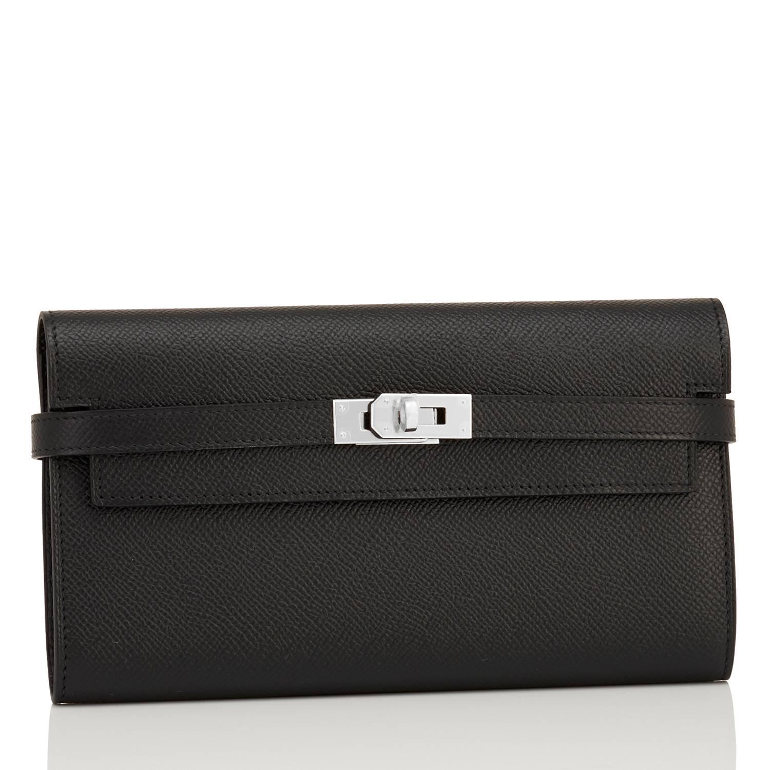 Hermes Black Kelly Long Wallet Epsom Palladium Hardware
Brand New in Box.  Store Fresh. Pristine Condition (with plastic on hardware)
Perfect gift! Comes with orange Hermes box for gift-giving.
The Black Epsom Kelly Wallet with Palladium Hardware is