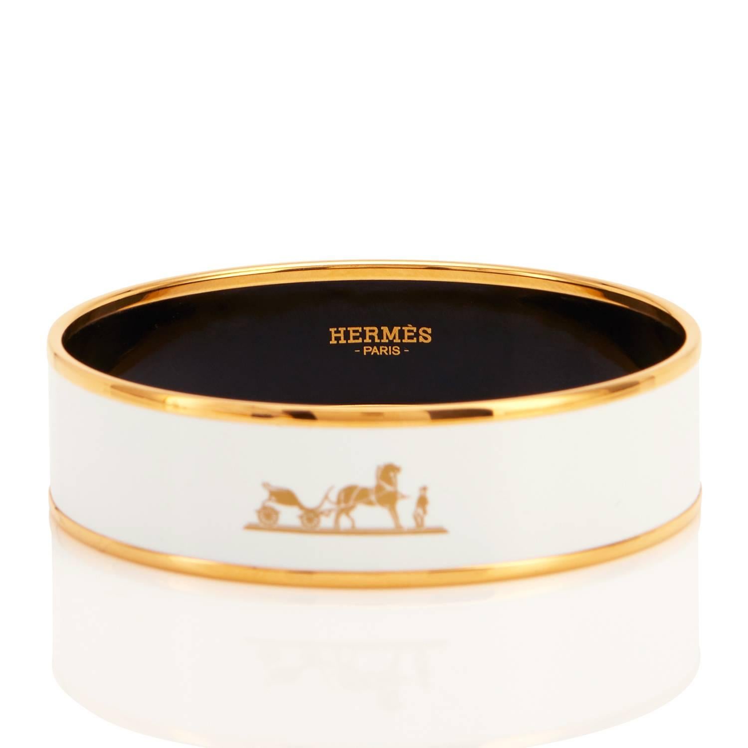 Hermes White Kelly Caleche Gold Enamel Bangle Bracelet 70
The iconic Kelly Caleche design is being discontinued. 
And this is the SOLD OUT, most wanted white colorway!
Brand New in Box.  Store Fresh. Pristine Condition.
Perfect gift! Comes with