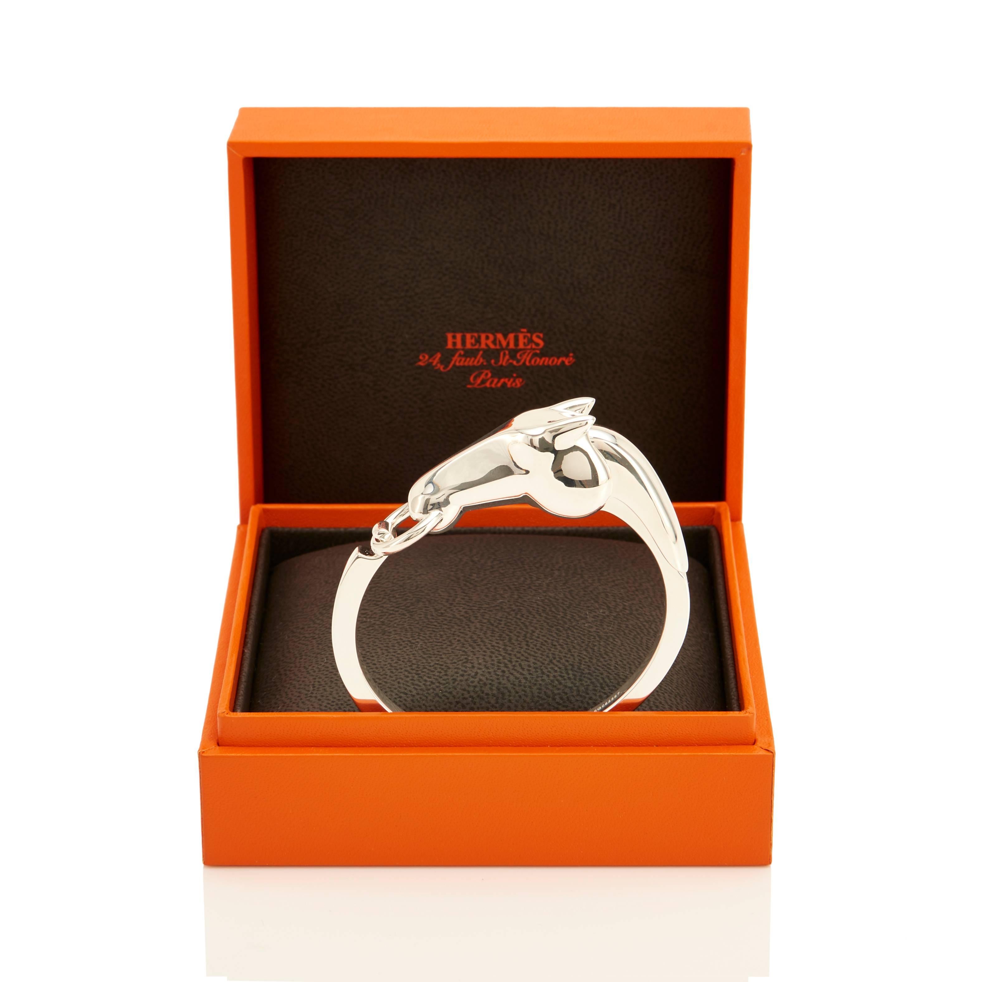 Hermes Iconic Solid Silver Horse Bracelet PM Standrad
Brand New in Box.  Store Fresh. Pristine Condition.
Perfect Gift! Comes full set with Hermes jewelry box.
Features Hermes' modern rendition of the house famous horse head.
Very classic but edgy