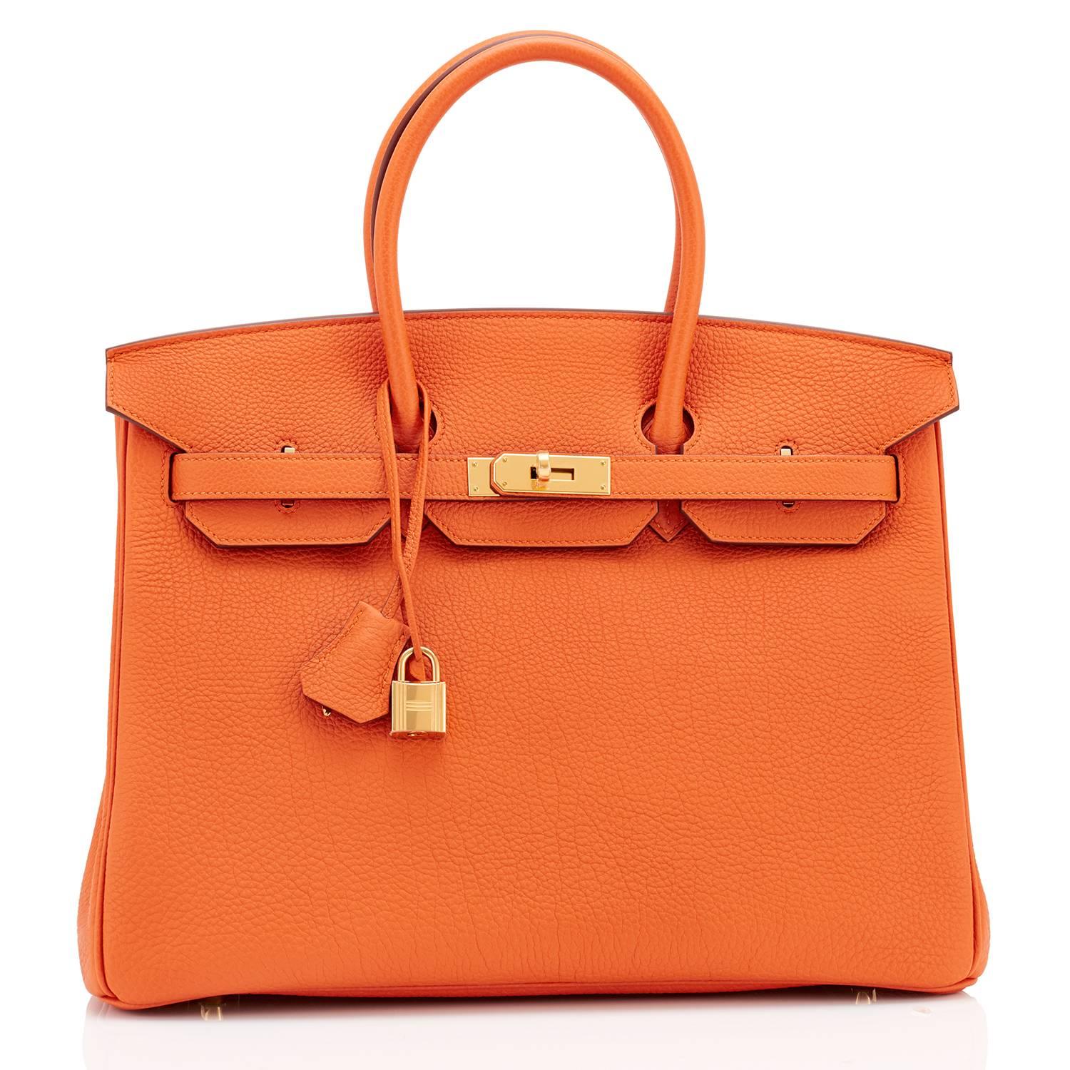 Hermes Classic Orange Togo 35cm Birkin Bag Gold Hardware Rare
Extremely rare find in NEW or Never Worn condition (with plastic on hardware). 
Perfect gift!  Comes in full set with lock, keys, clochette, sleeper, raincoat, and Hermes box. 
This is