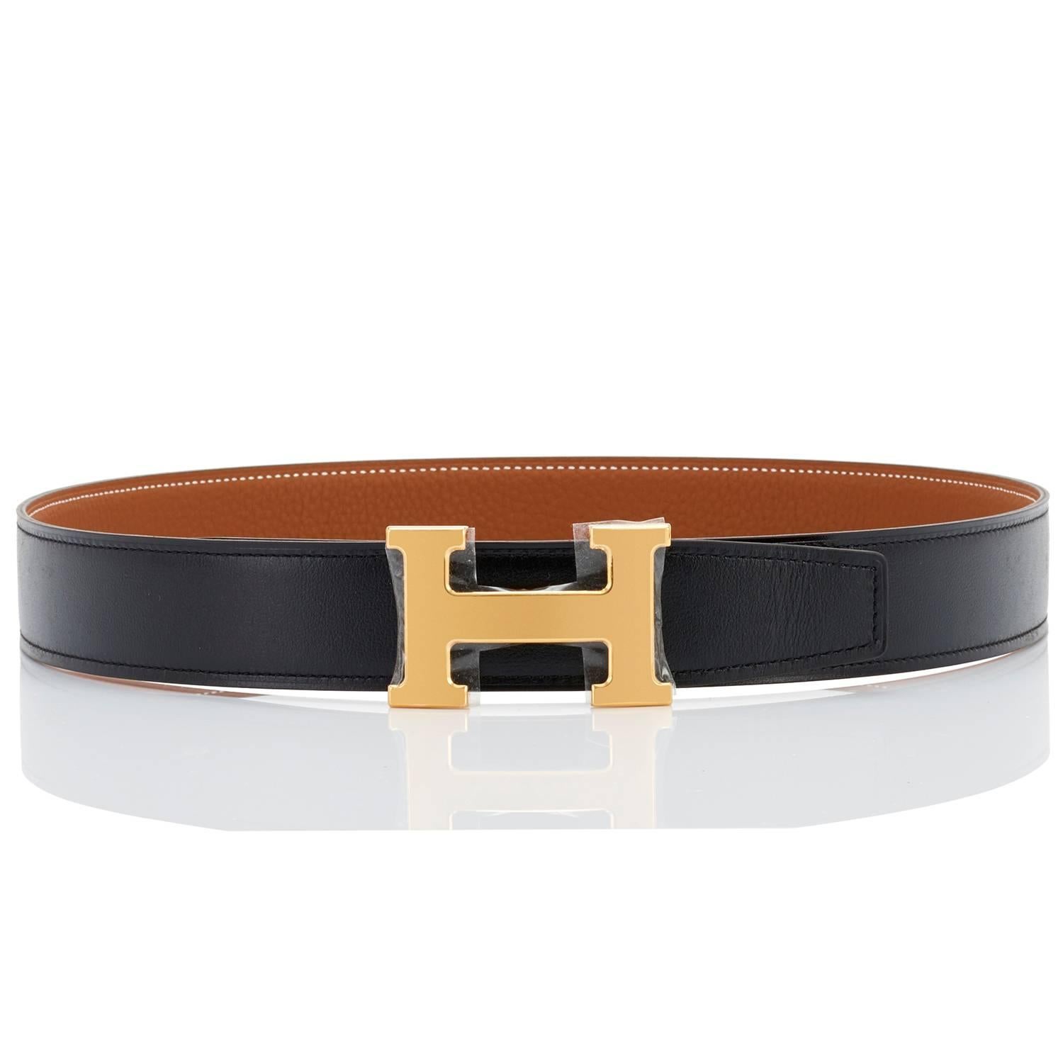 Hermes Gold and Black Reversible H 32mm Belt Kit Silver Buckle 85cm
Brand New in Box. Store Fresh. Pristine Condition.
Perfect gift! Belt kit comes in full set with reversible black and gold belt strap, gold buckle, Hermes dust bag for belt buckle,