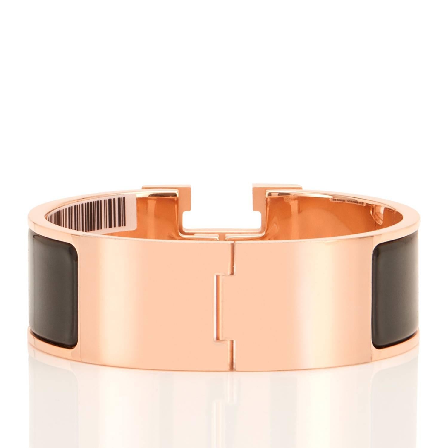 Hermes Black Clic Clac Rose Gold Enamel Bangle Wide Bracelet PM
Brand New in Box; Store Fresh. Pristine Condition.
Perfect gift! Comes with Hermes velvet pouch and orange Hermes box.
Sold out at most Hermes stores!
Black Enamel. Wide model. Size PM.
