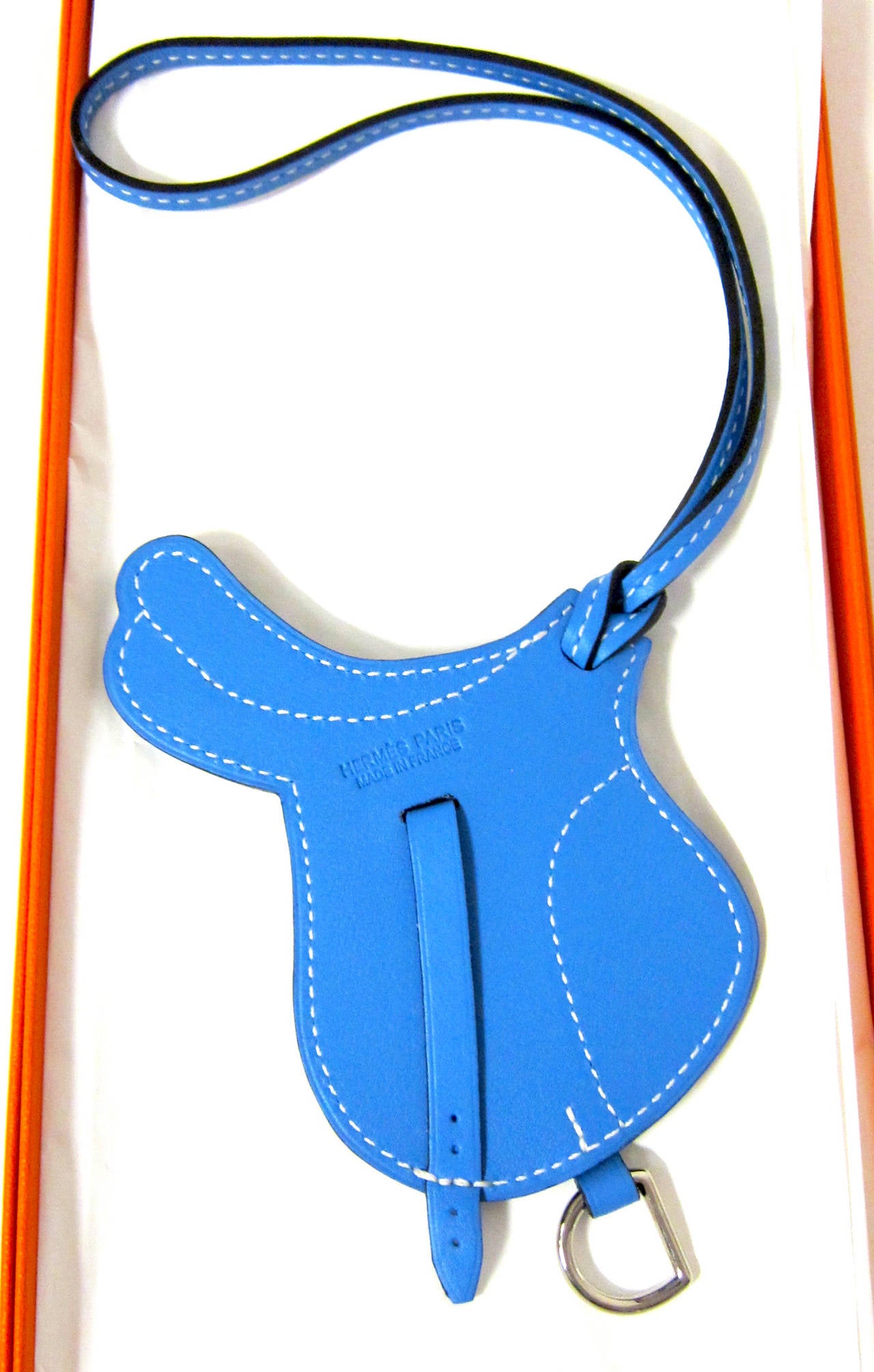 HERMES BLUE PARADIS SADDLE PADDOCK FLOT BAG CHARM 

Adorable! Brand new in box
Store fresh, never worn, coming with Hermes box and ribbon
Don't miss this buttery gorgeous Hermes Blue Paradis Saddle Paddock Selle Bag Charm, perfect for any