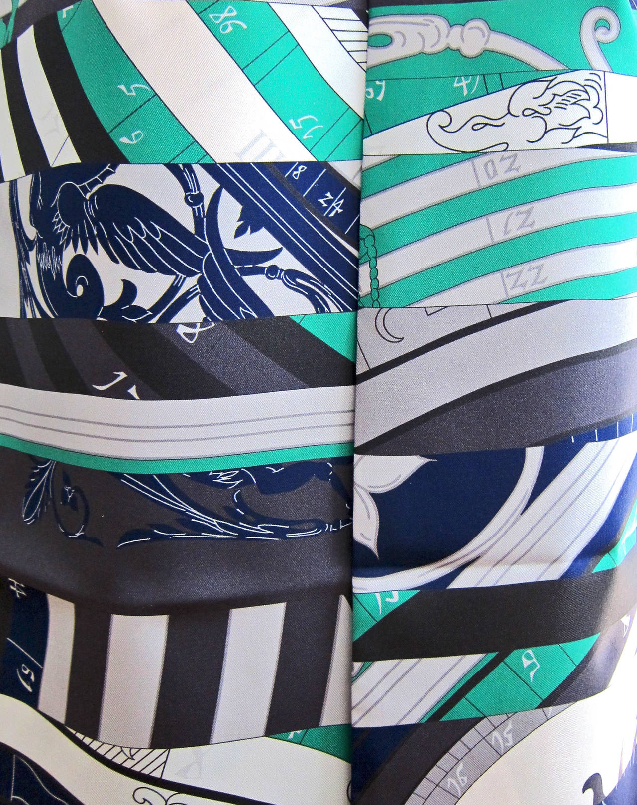 Hermes Astrologie Nouvelle Maxi Twilly Silk Scarf

Colors: Blues, green, grey, etc. 
Perfect gift! Brand new in box.
Absolutely store fresh. Never used with no issues or flaws. 
Comes brand new with Hermes Maxi Twilly cylindrical box with