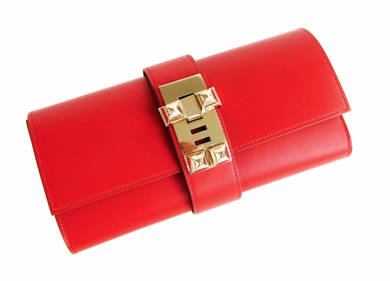 Hermes Sanguine Red Permabrass Medor Pochette Tadelakt Bag Clutch

Perfect Gift! Brand New in Box- Store Fresh. Never Carried.
Comes in full set with Hermes dust bag, ribbon, and box.
Sanguine is a sophisticated red with slight coral and slight
