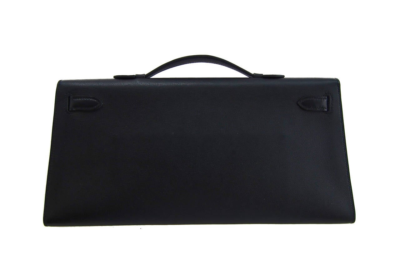 Hermes Black Kelly Longue Swift Leather Clutch Bag Discontinued

Very rare Kelly Longue Clutch
The most classic and versatile Black color
Very chic with iconic Hermes Kelly closure in palladium hardware
Swift leather is smooth and