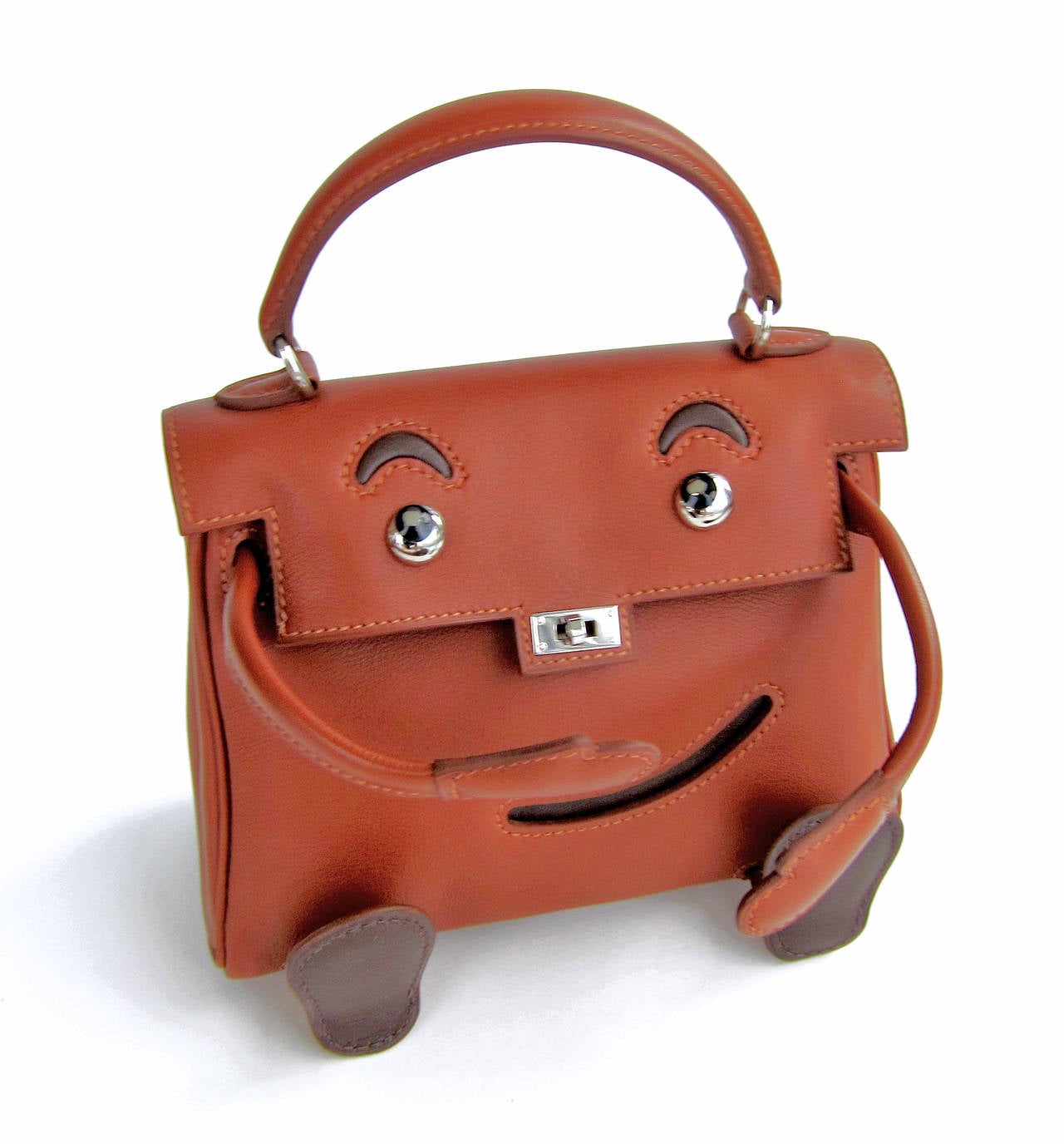 Hermes Quelle Idole Kelly Doll Bag Noisette Leather Rare Limited Edition 
Extremely limited edition Hermes Kelly Doll bag.
Completely rare and very few exist in the world today.
This shrunken down Kelly bag is beyond precious.
Adorned with a